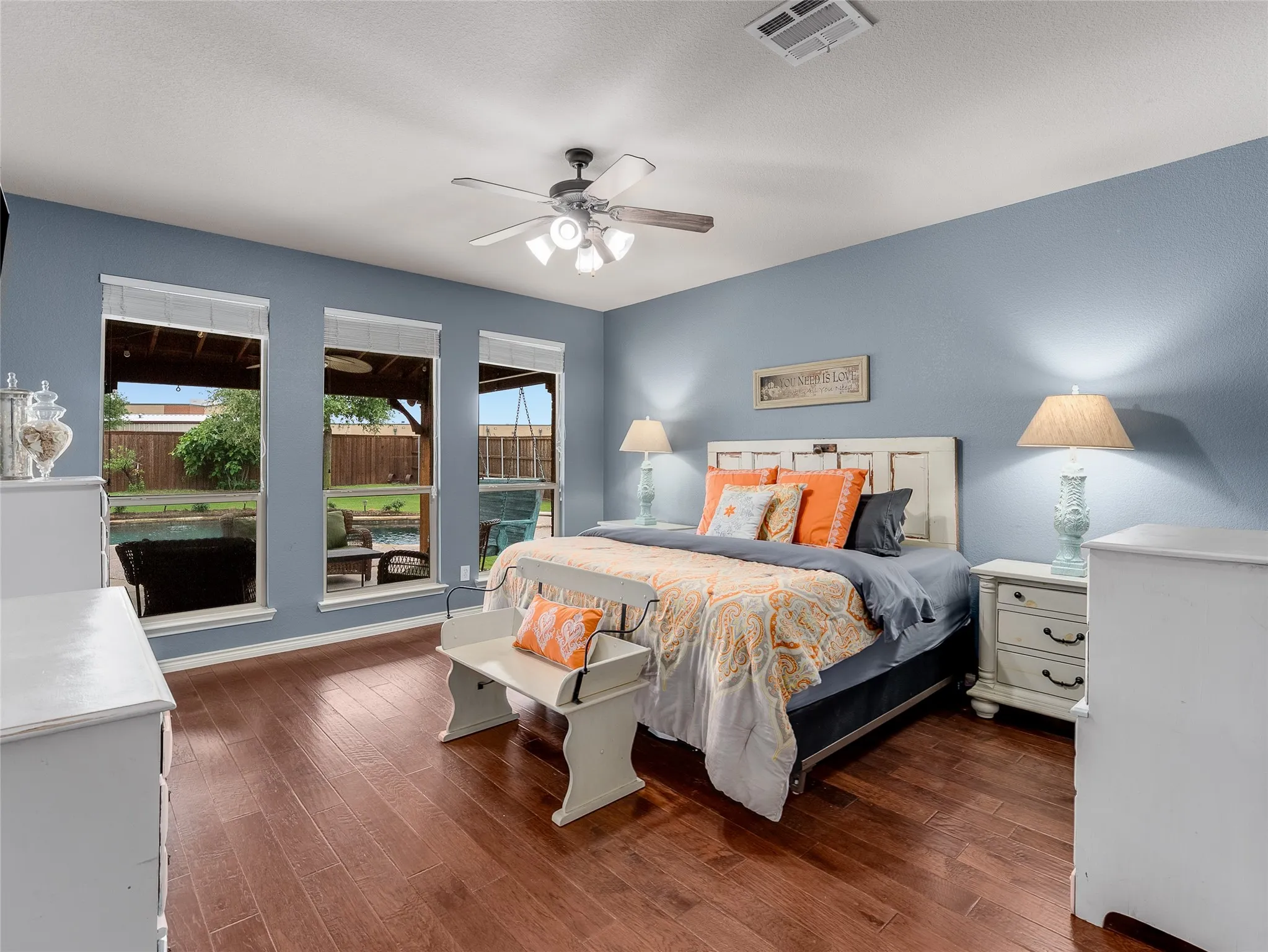 Primary overlooking pool and covered patio.