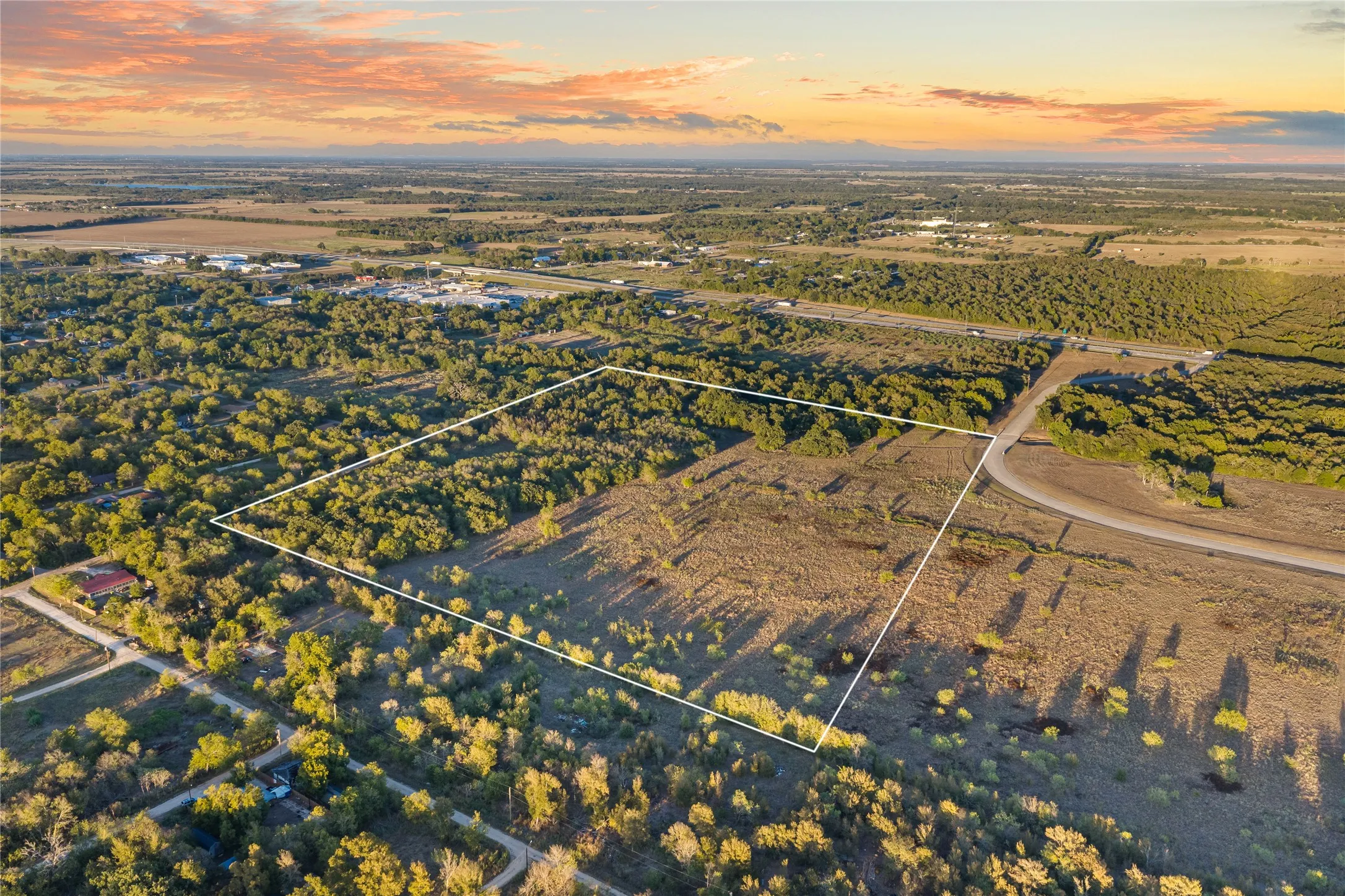 Expansive lot featuring mature trees and clearings