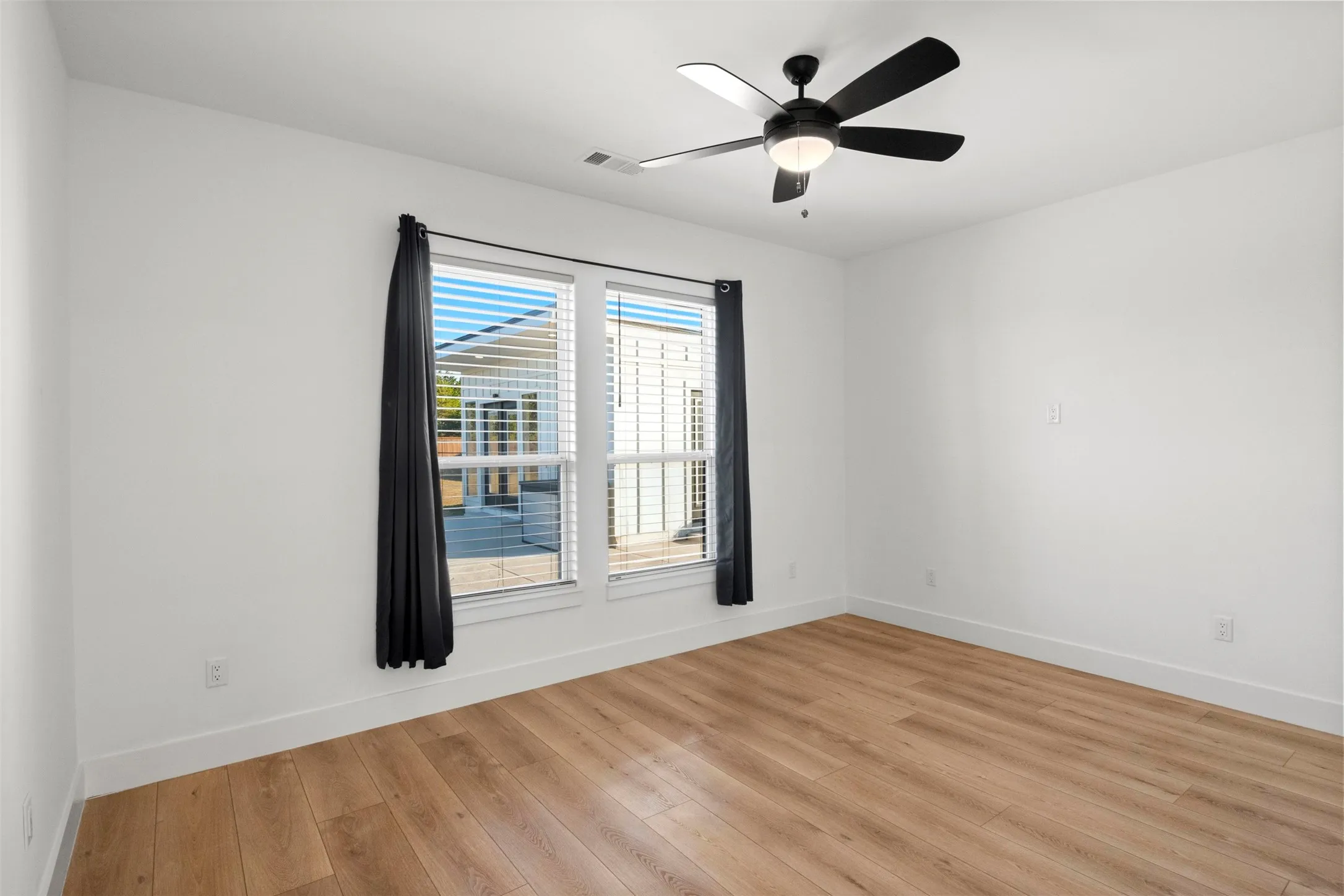 Comfortable secondary bedroom with natural light.