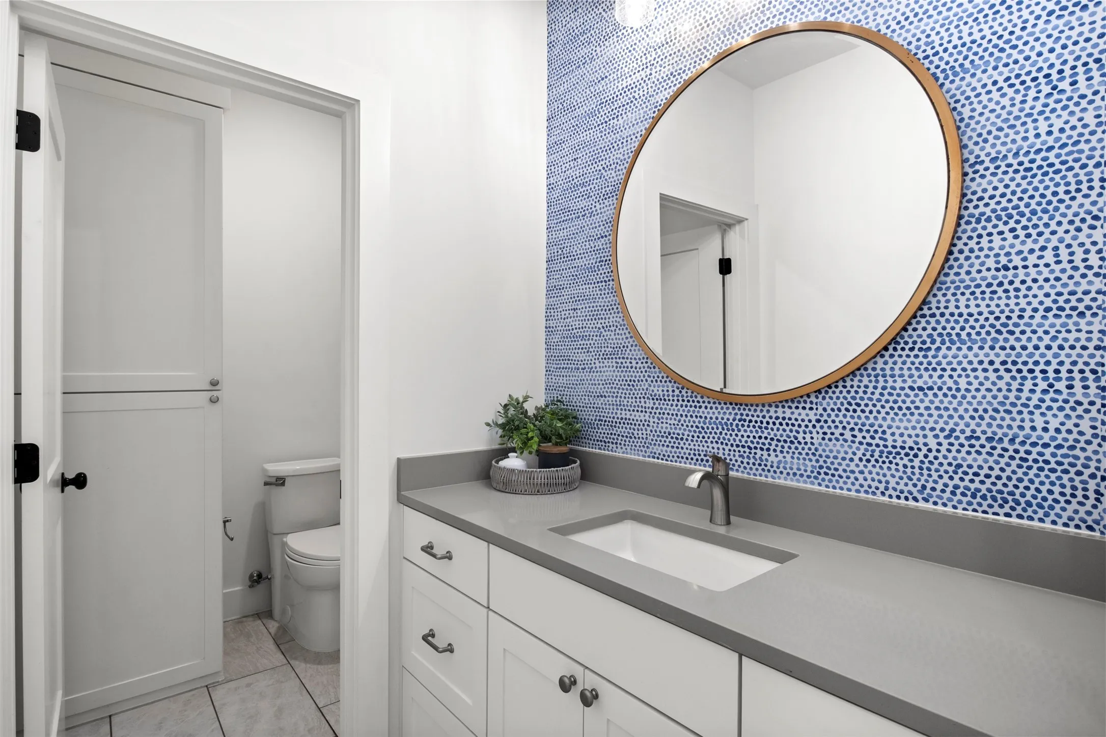 Thoughtful finishes and a distinctive accent wall in secondary bedroom