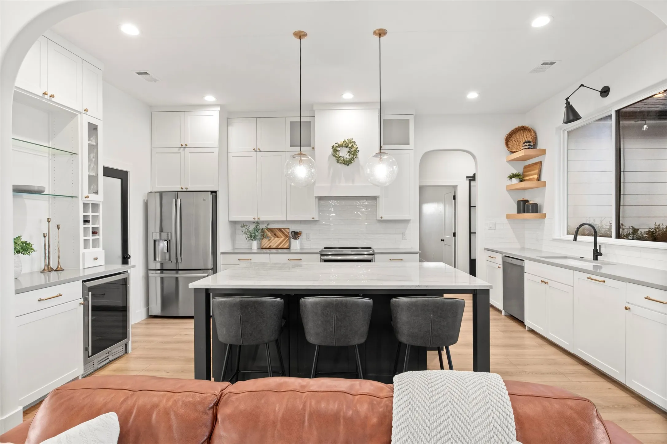 Dedicated beverage station with built-in undercounter refrigerator.
