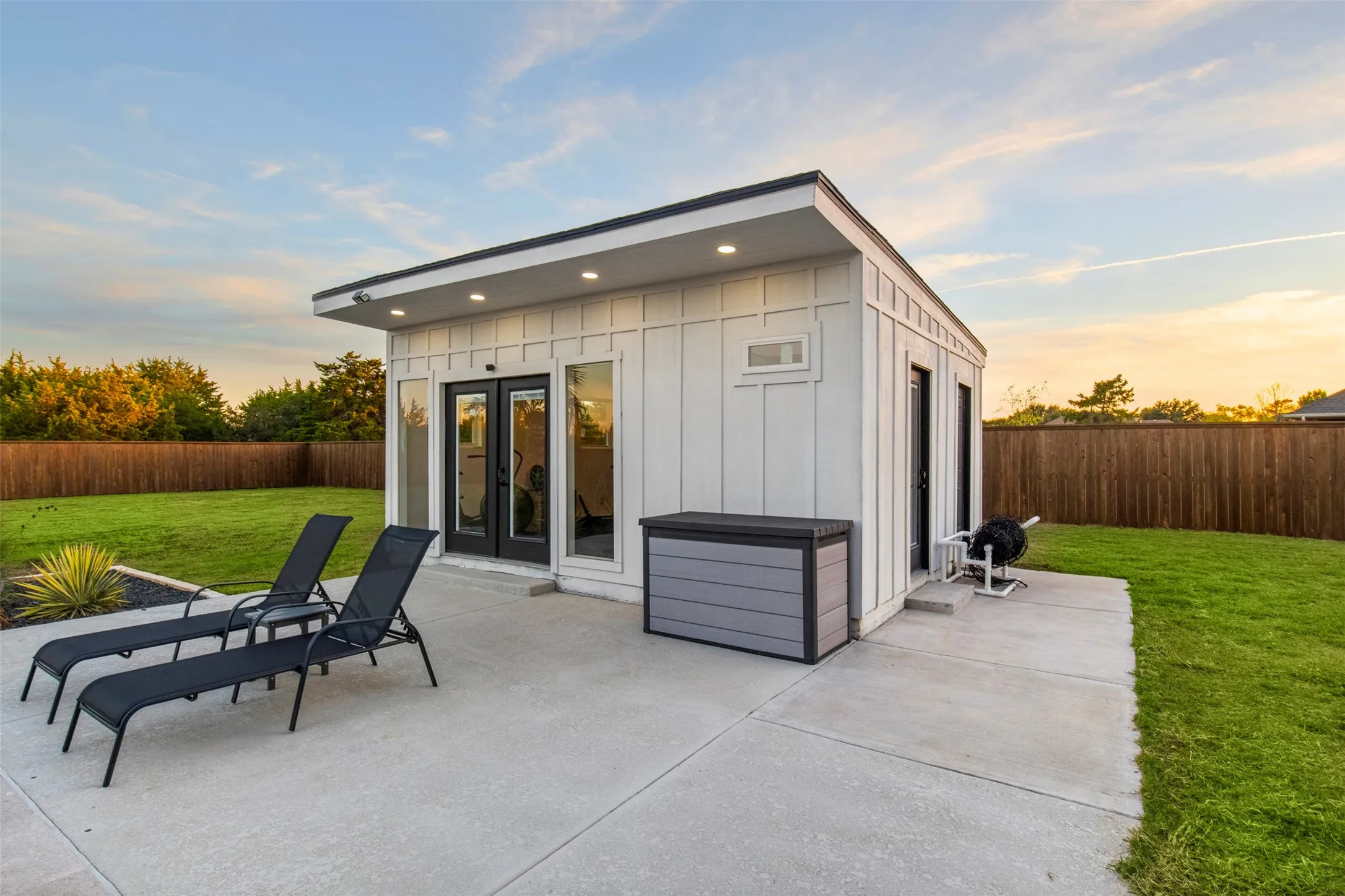 Separate pool house with flexible-use interior and full bathroom.