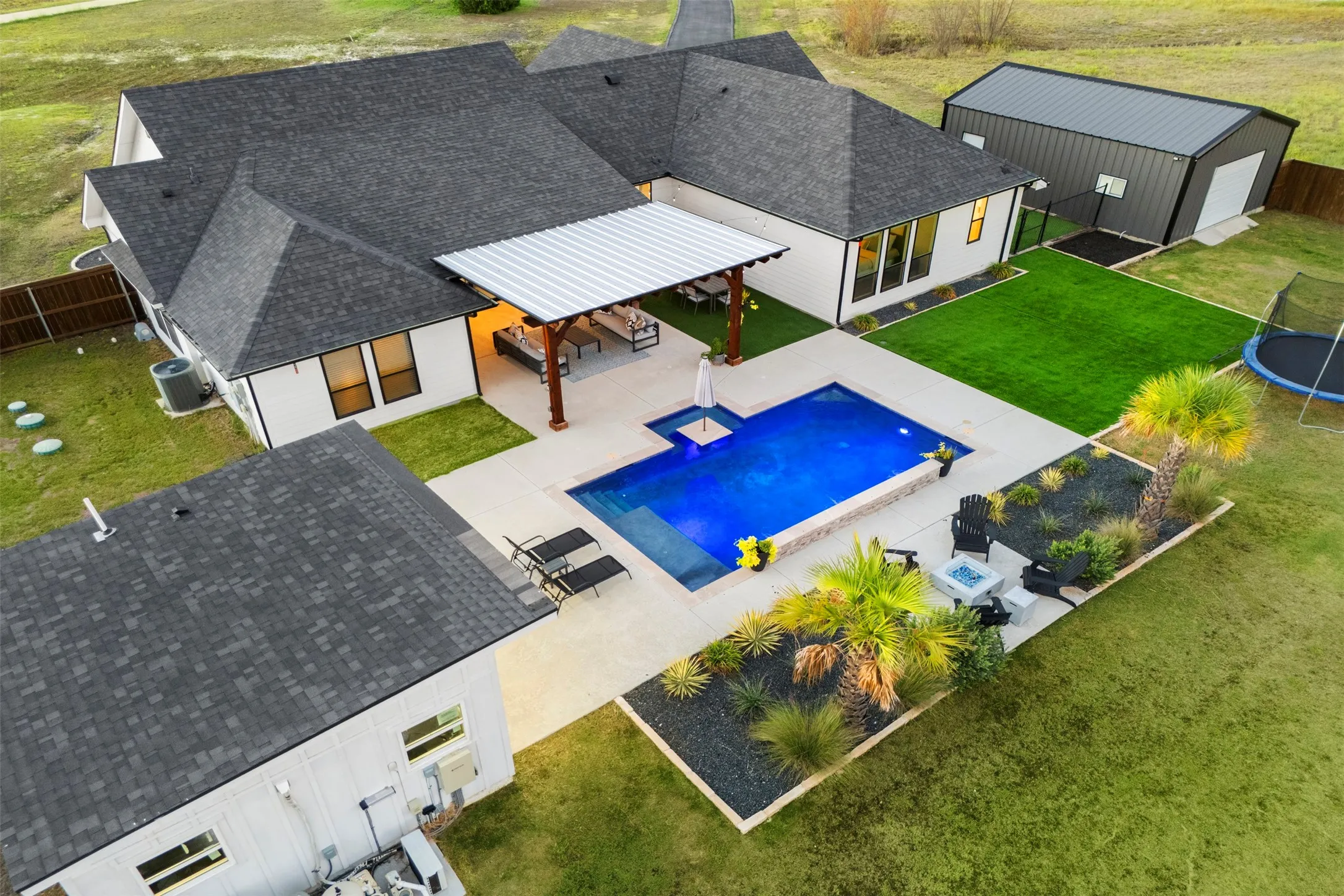 The complete package: Augusta Custom Homes construction, resort-style pool, separate pool house and powered shop on 1.224 acres.
