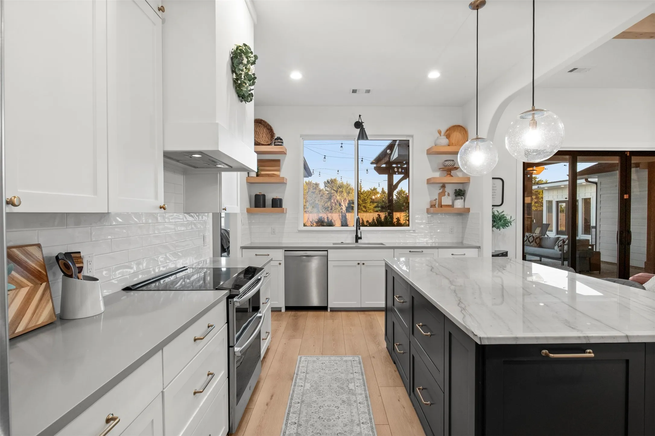 Natural wood shelving, black accents, and arched architectural details.