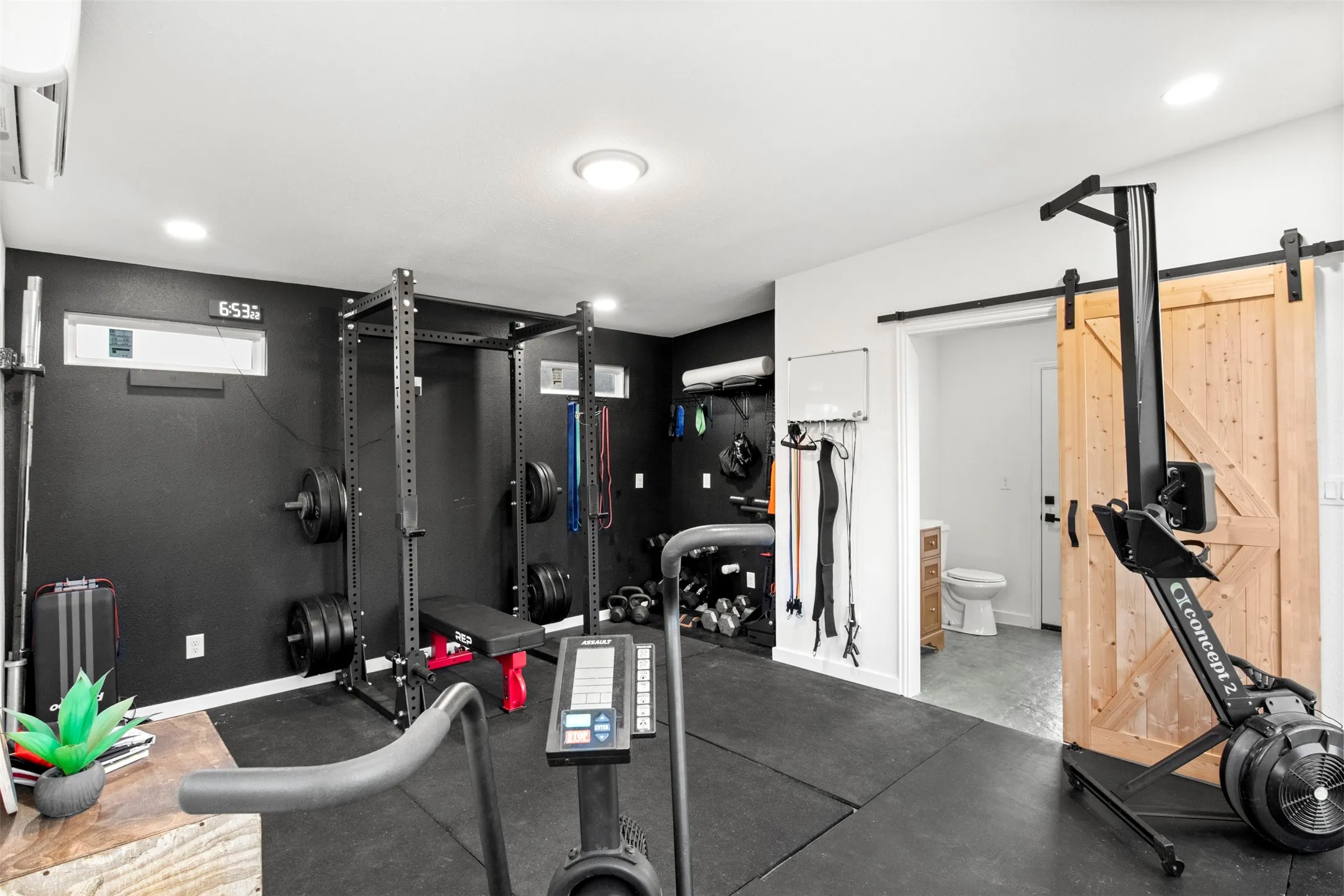 Currently configured as a private gym with room for exercise equipment. or flexible use.