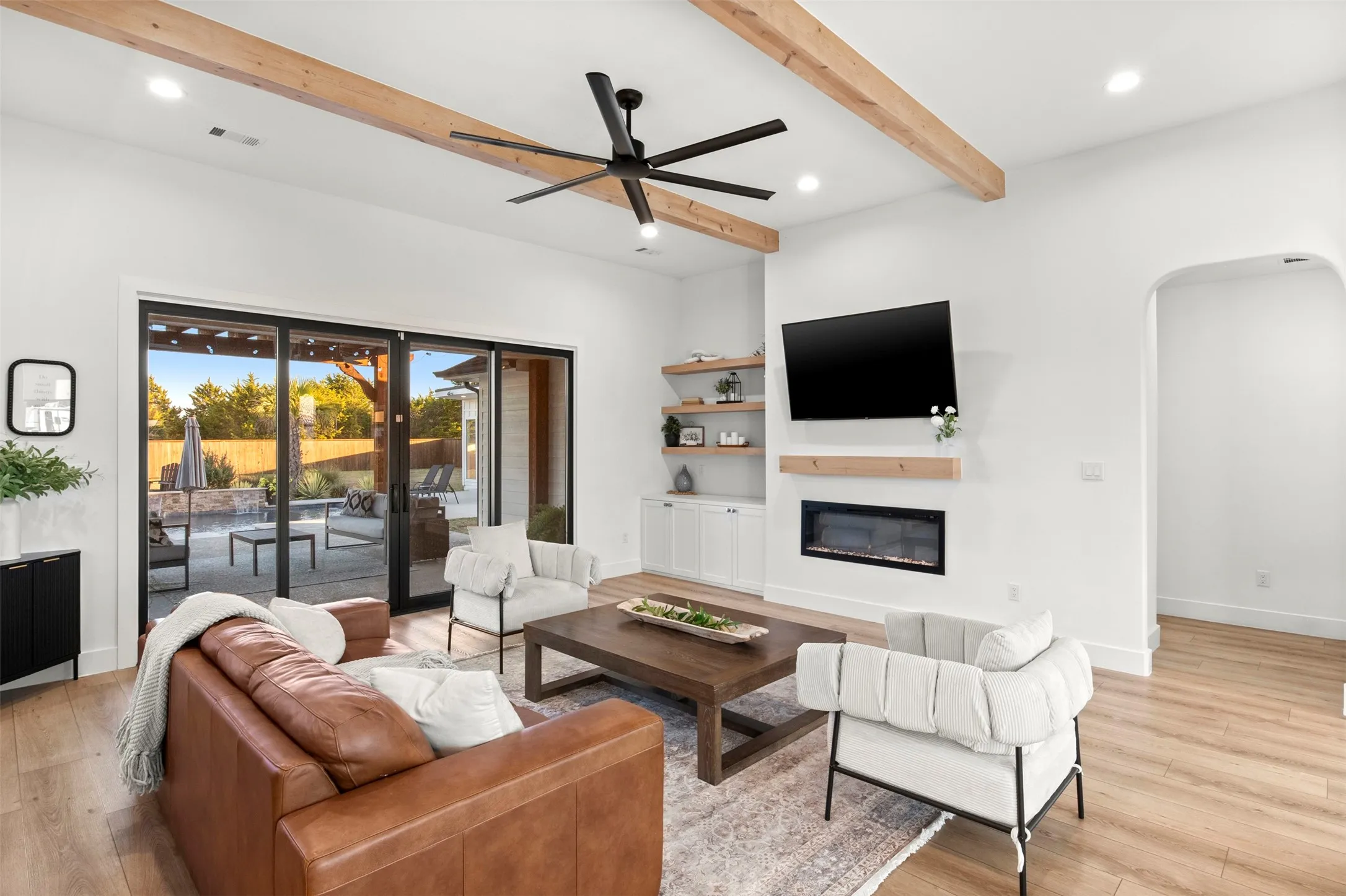 Expansive multi-panel sliding glass doors connect indoor and outdoor living.