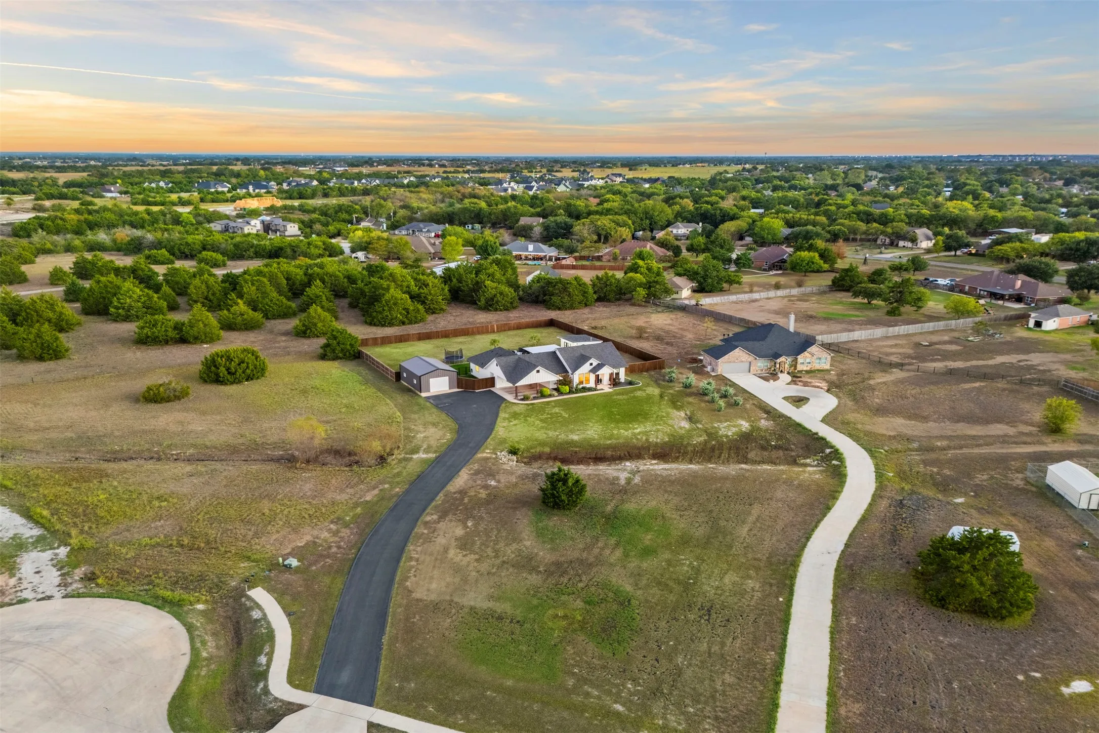 Cul-de-sac location outside city limits with no HOA and a setting of larger residential properties.
