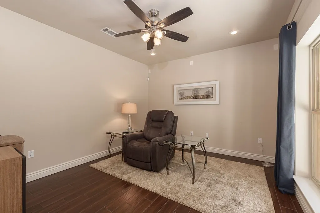 Recessed lighting, ceiling fan with integrated lighting, wood-finish flooring, light-toned wall paint, and white trim