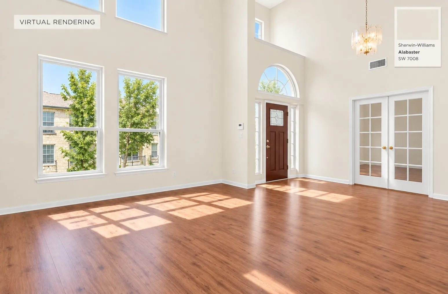 Double-height ceiling featuring large windows, wood-finish flooring, a multi-light chandelier, a dark-finish entry door with decorative glass inlay, and French-style doors