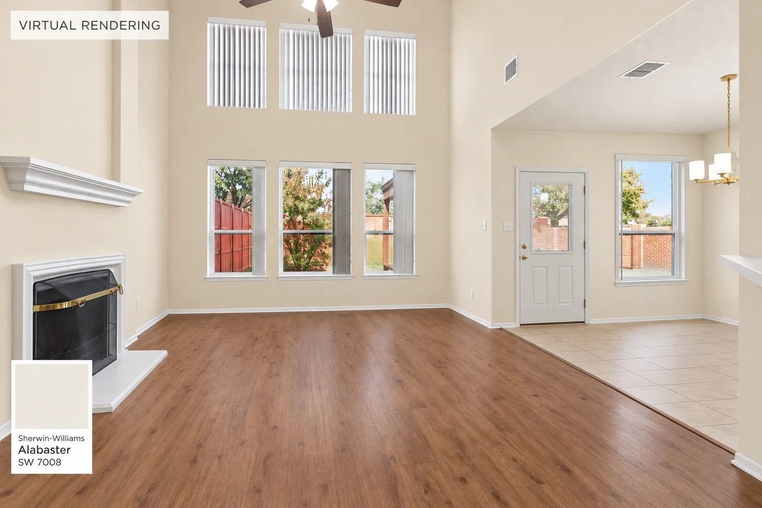 Vaulted ceiling, wood-finish flooring, white fireplace, upper transom windows, and an exterior access door