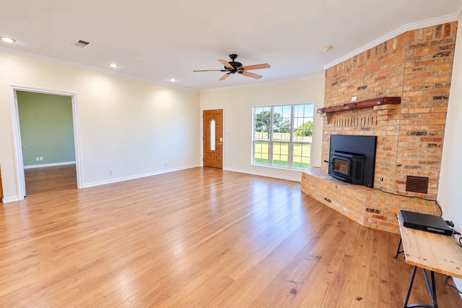 Brick fireplace features wood burning stove
