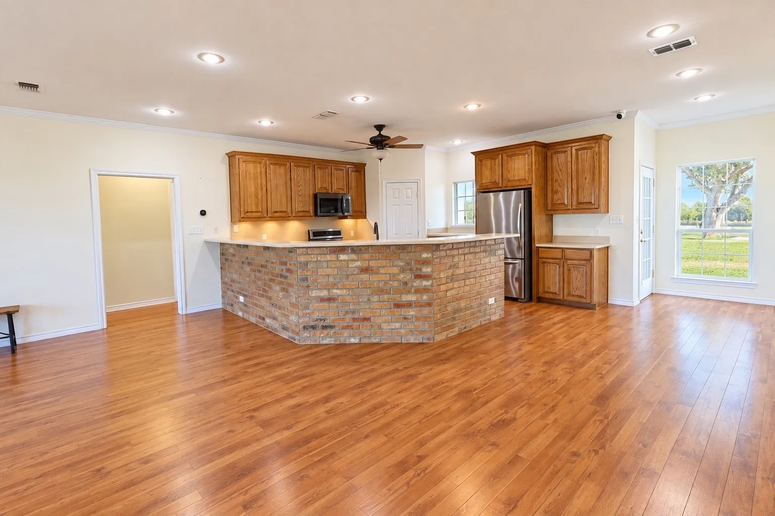 Brick accents on island match fireplace