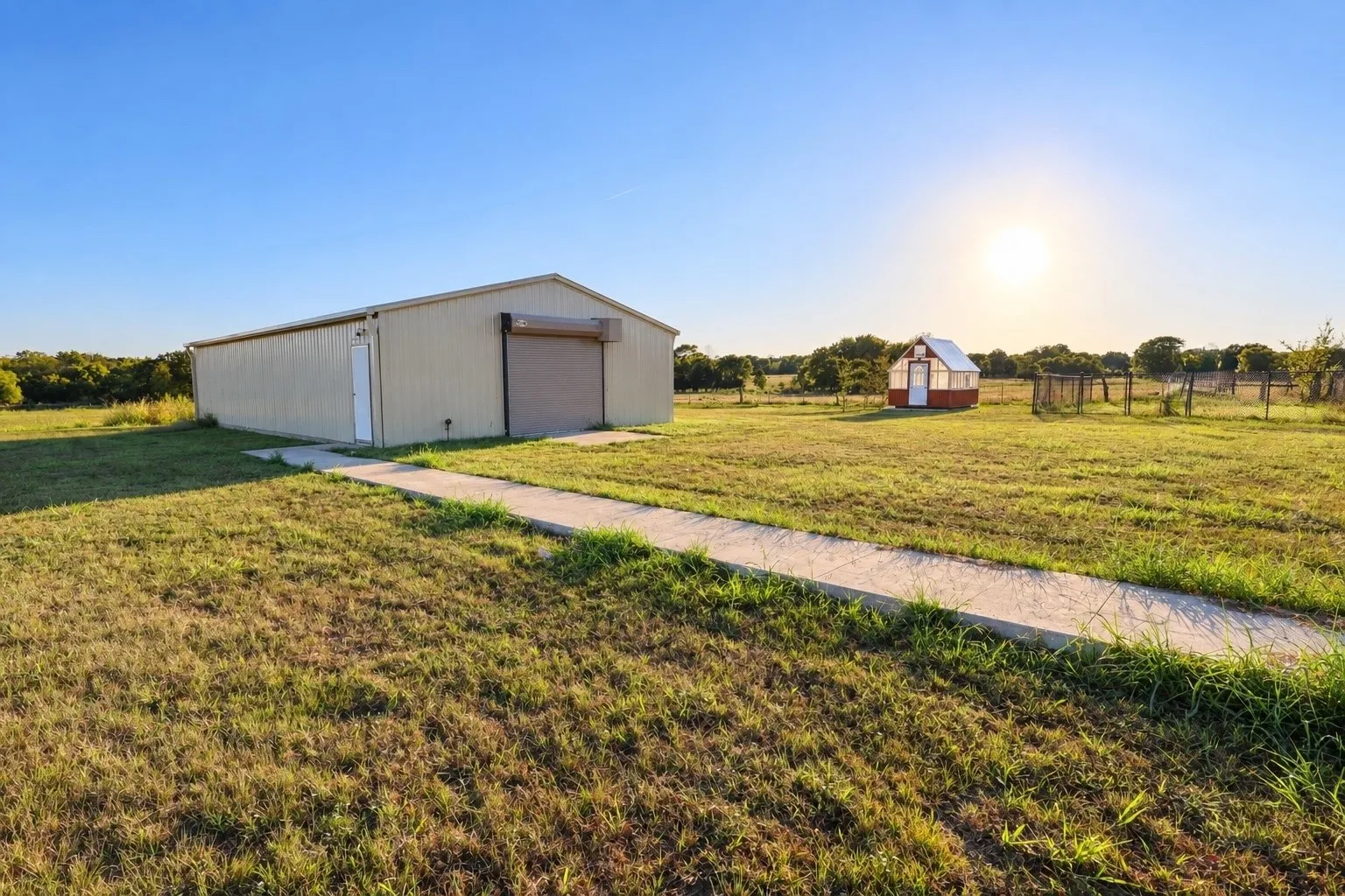 30' x 55' insulated shop with 3 ton mini split, plumbing and 115 and 450 electrical.