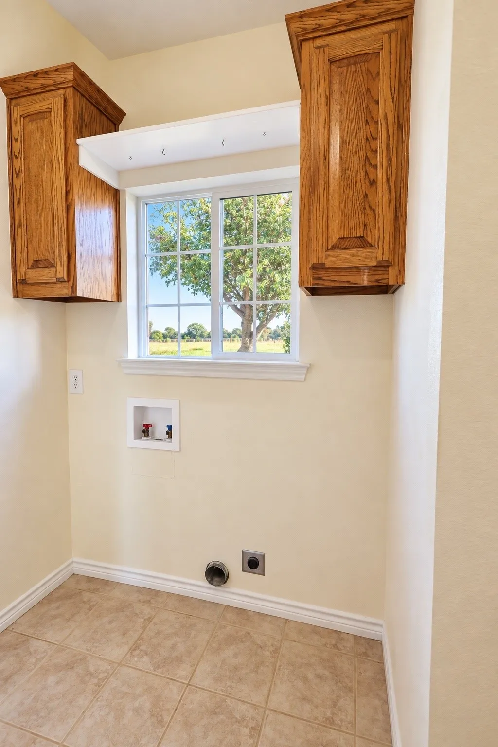 Laundry room is accessible from kitchen, primary bath and back door entry.