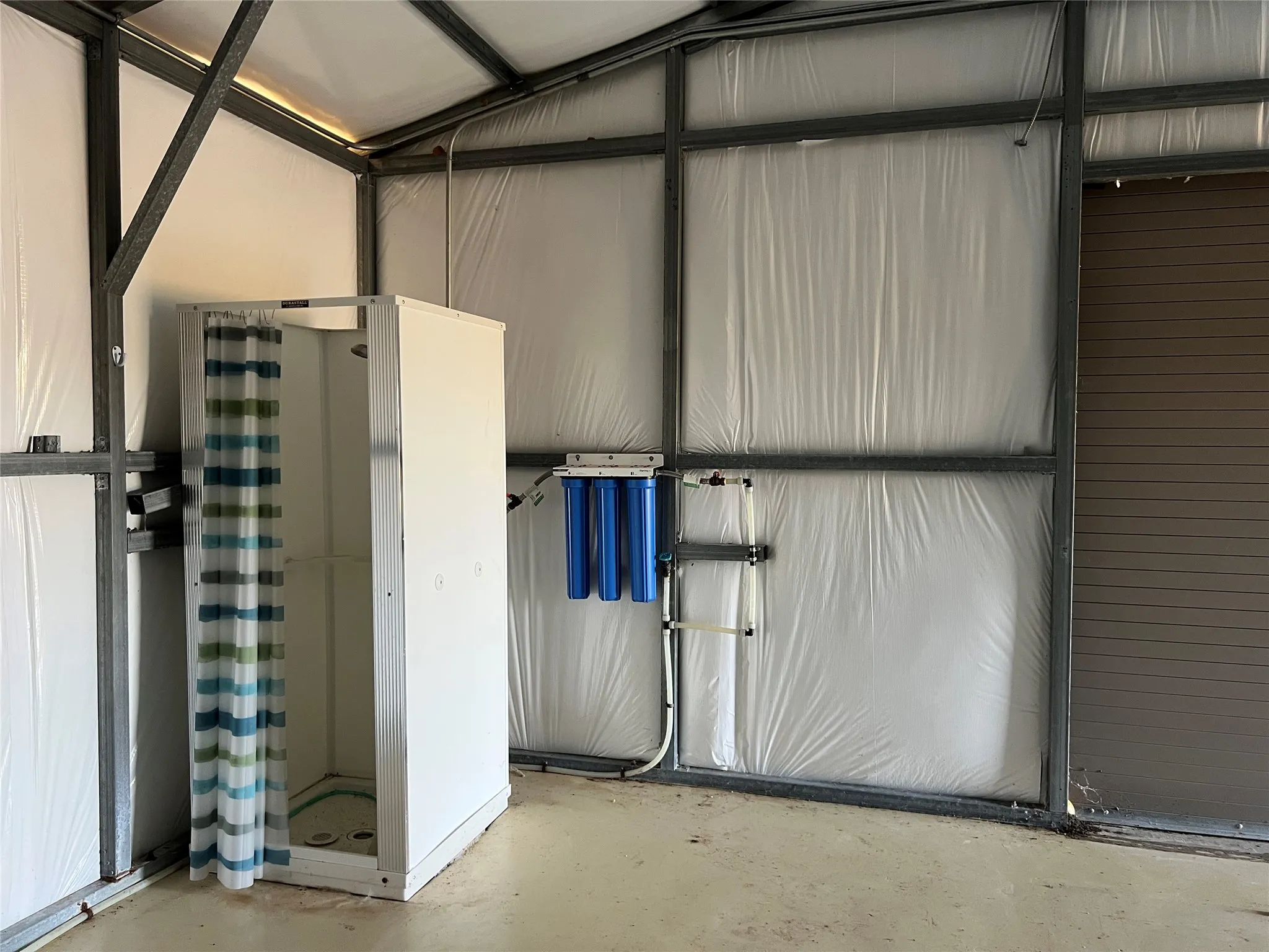 Shower and water filtration system inside shop.