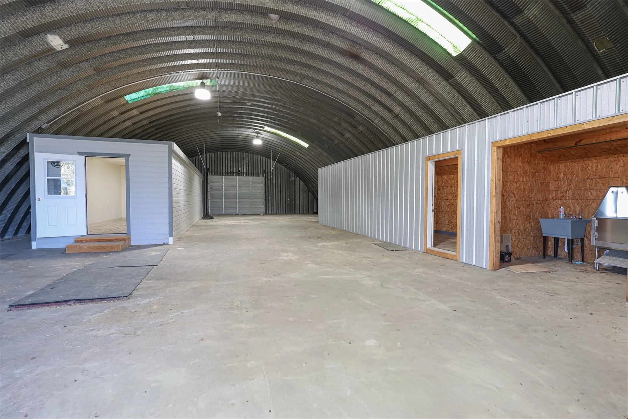 Interior of Quonset hut has finished "craft room" and addtl 10' x 40' storage with water and 200 Amp electric.