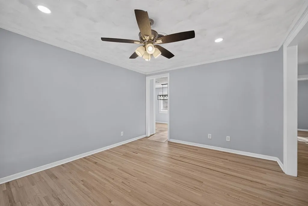 Hardwood flooring, recessed lighting, and a ceiling fan with integrated light fixture