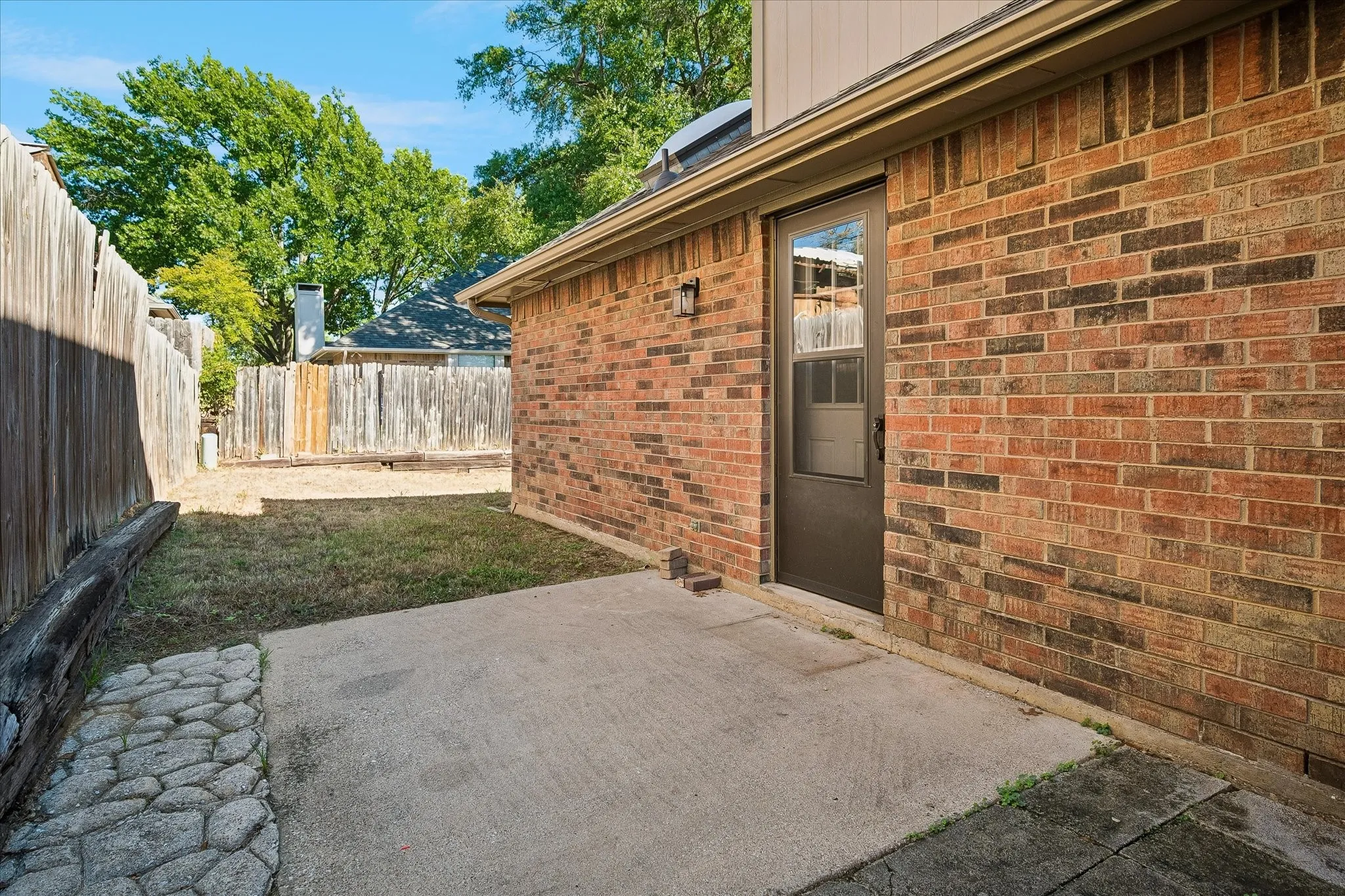 Private patio area located on side of house