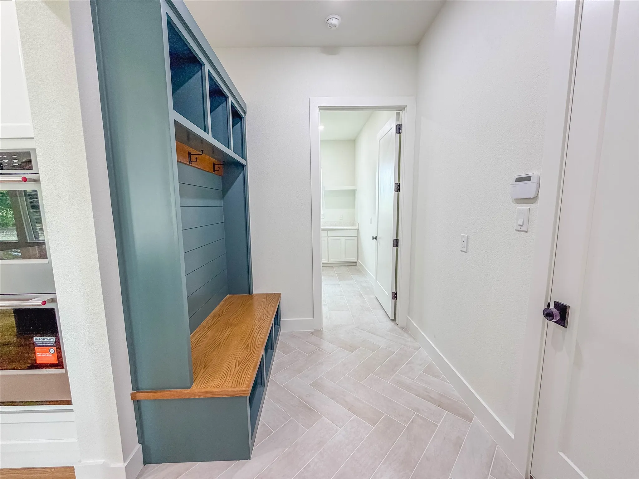 Built-in mudroom bench with cubbies and coat hooks