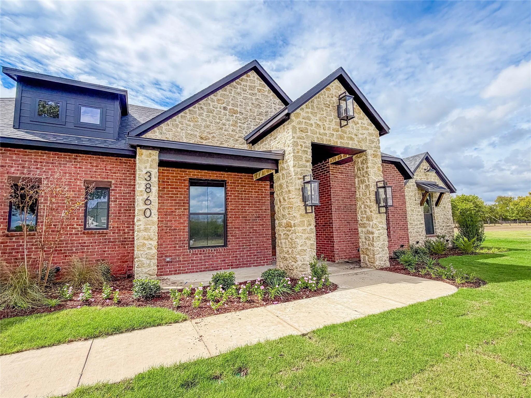 Brick and stone exterior with black-framed windows
