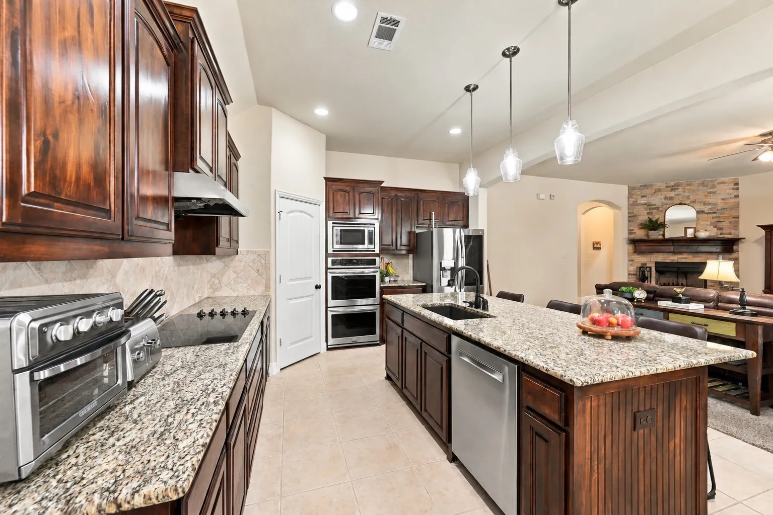 Gorgeous kitchen featuring stainless steel appliances and double ovens.