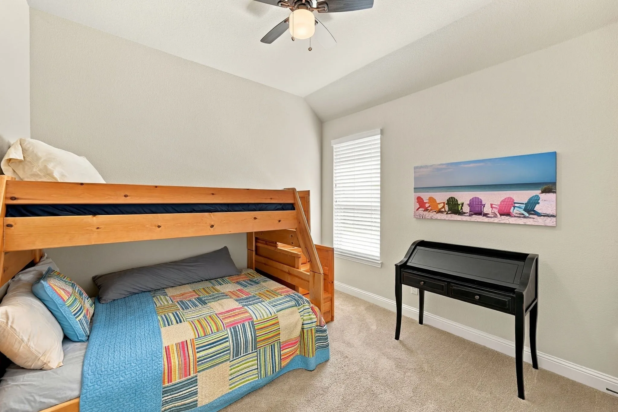 Bedroom 4 featuring natural light and ceiling fan.