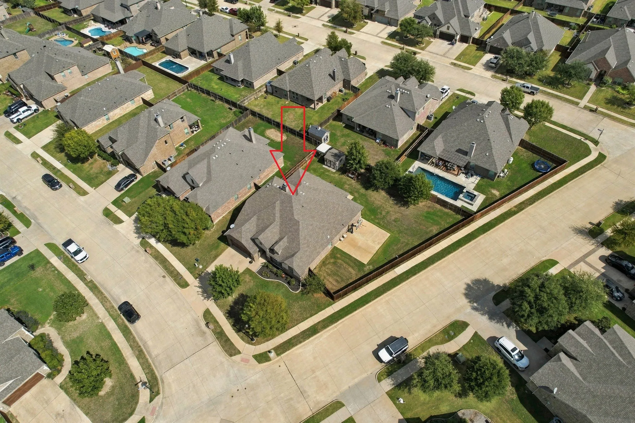 Gorgeous corner lot with beautiful yard and basketball court.