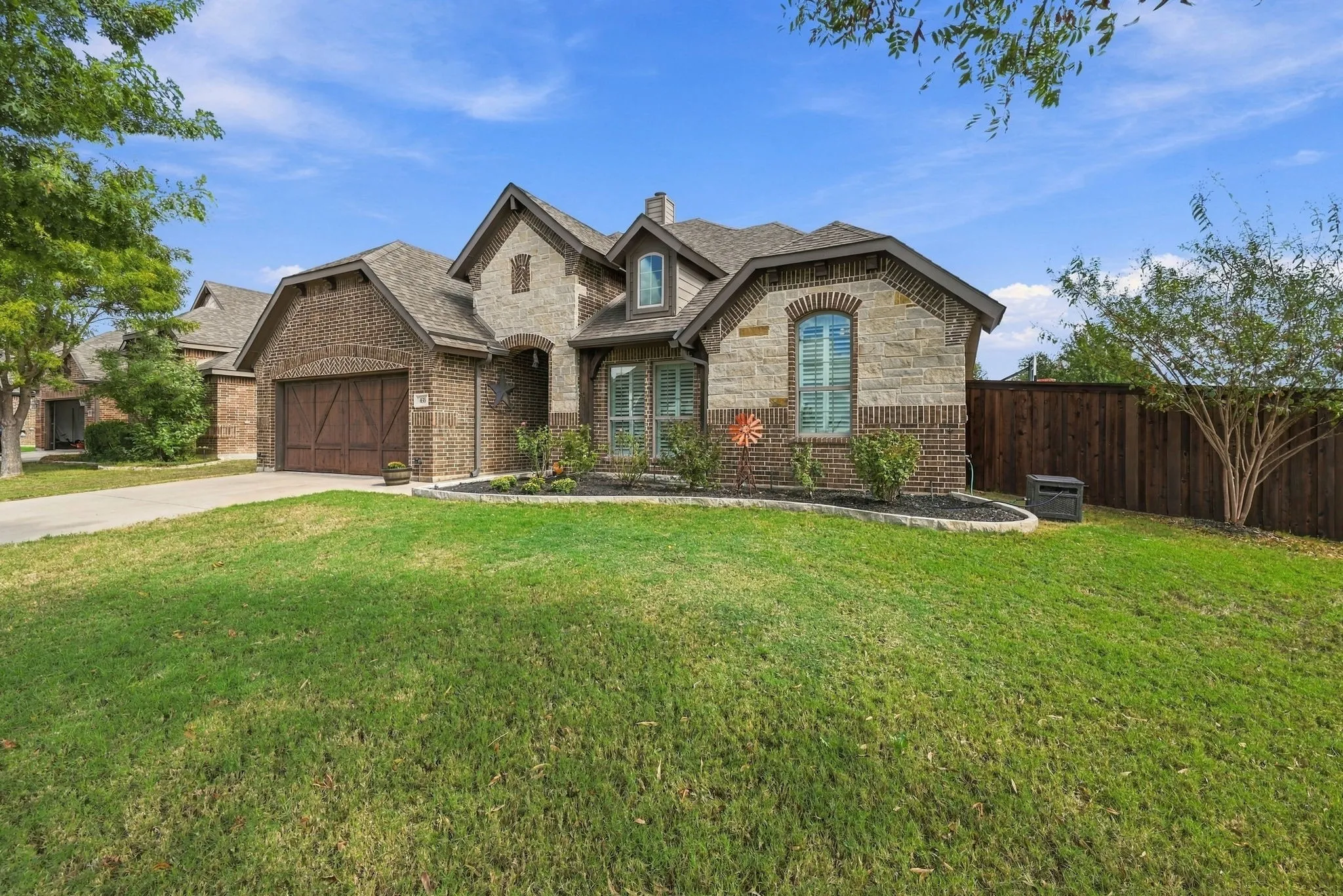 Large corner lot with mature trees.