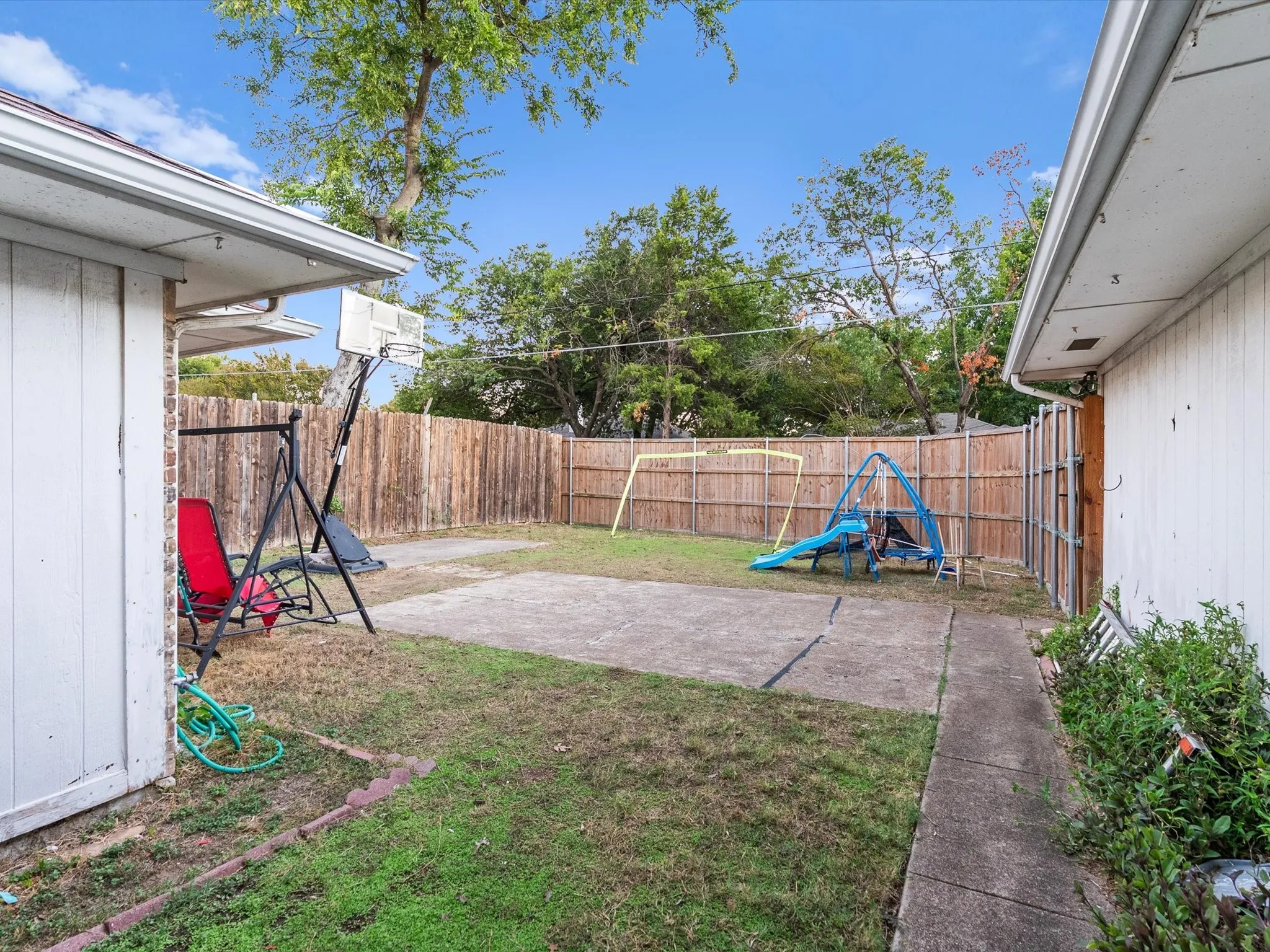 Backyard featuring a privacy fence, and concrete patio