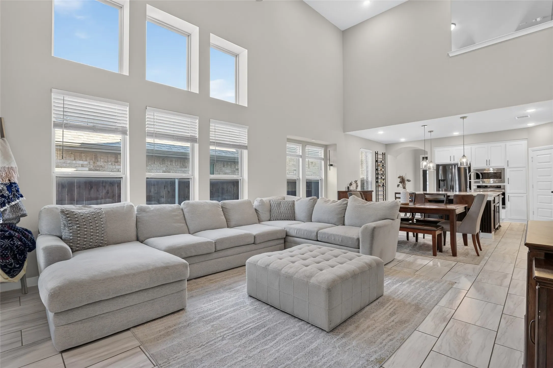 Soaring ceilings with upper transom windows