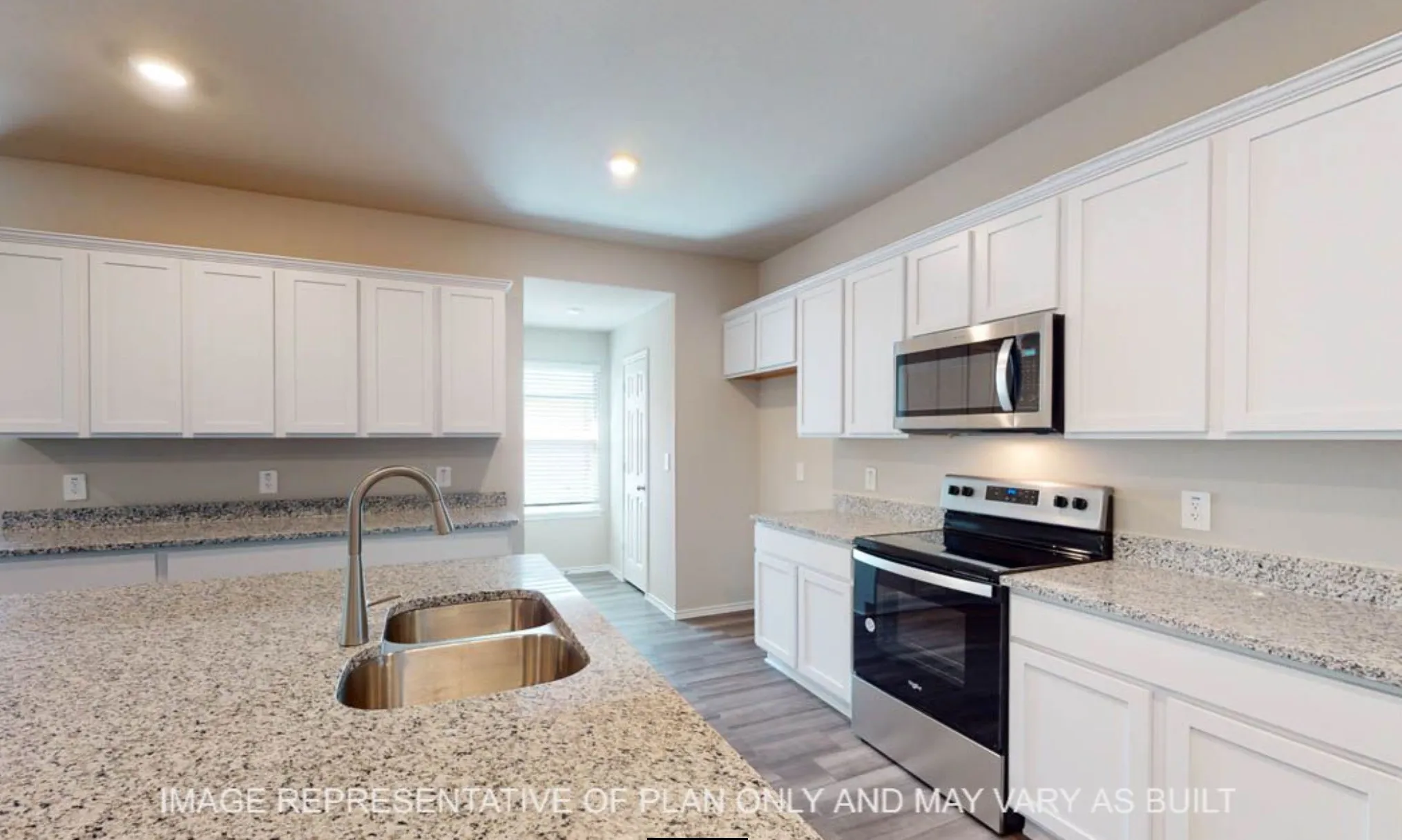 Kitchen featuring white cabinetry, light-toned granite countertops, stainless steel appliances, a double basin sink with a gooseneck faucet, and wood-finish flooring