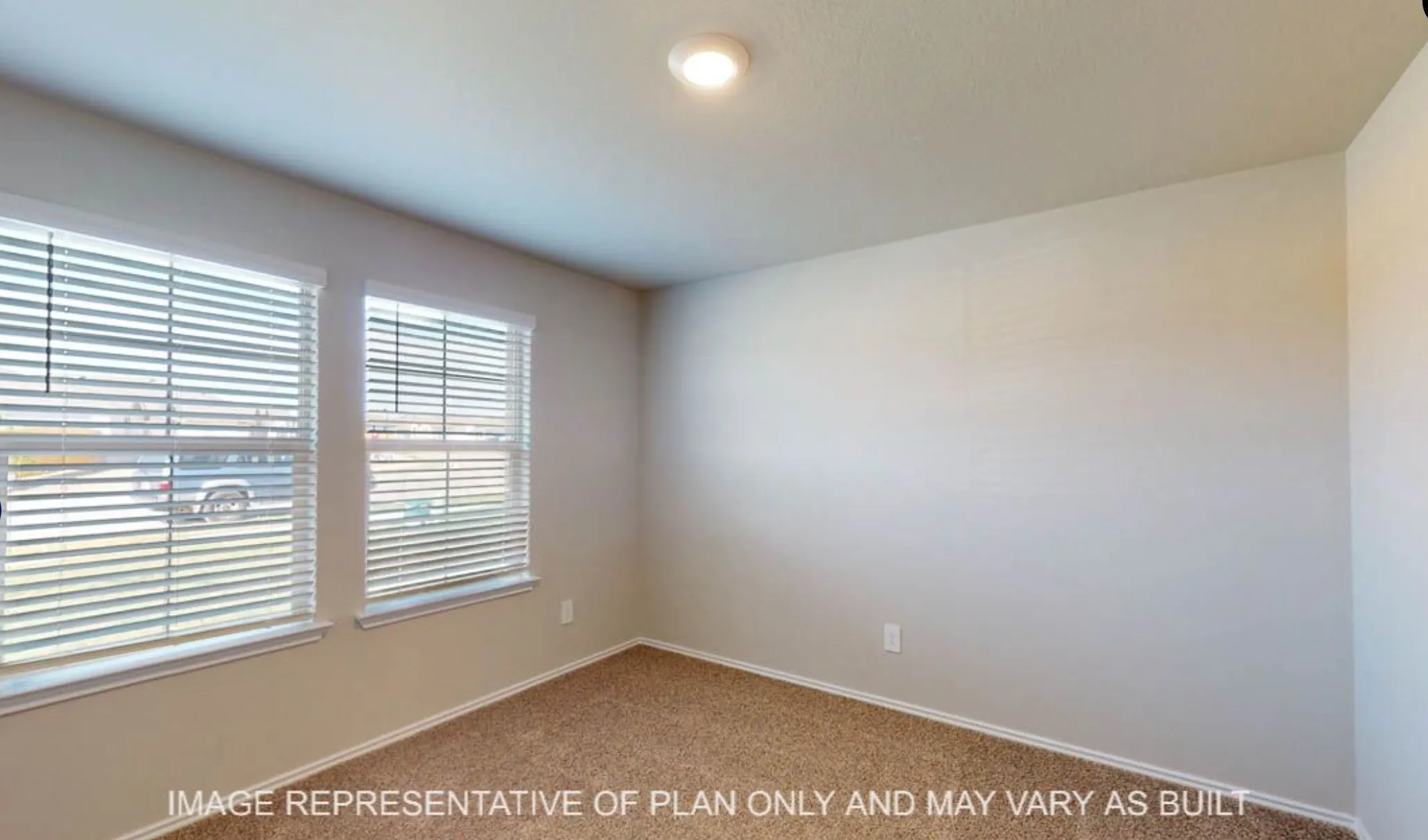 Two windows with blinds, recessed ceiling light, and neutral wall paint