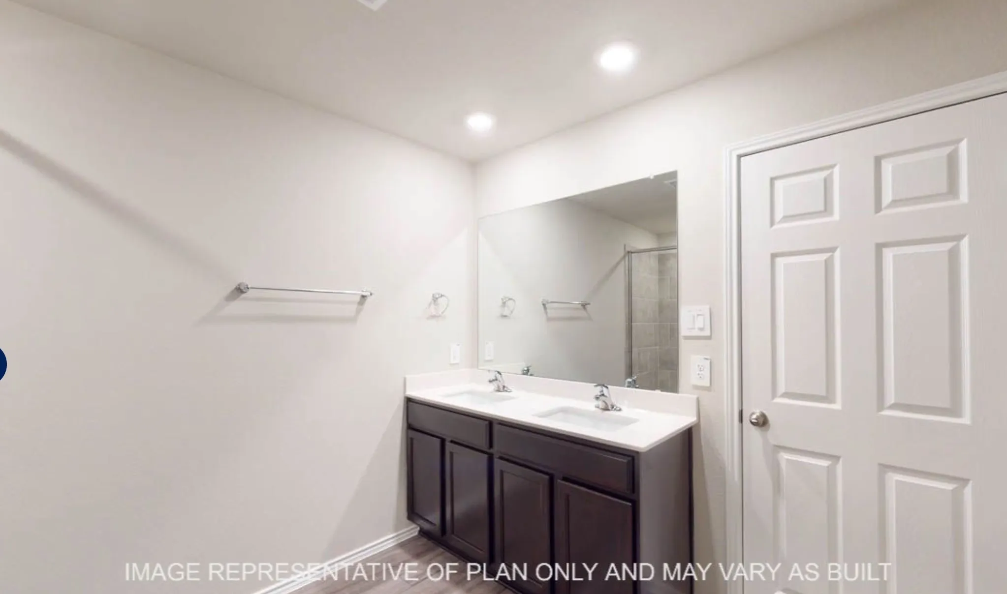Dual vanity with undermount sinks, chrome faucets, and a full-width mirror