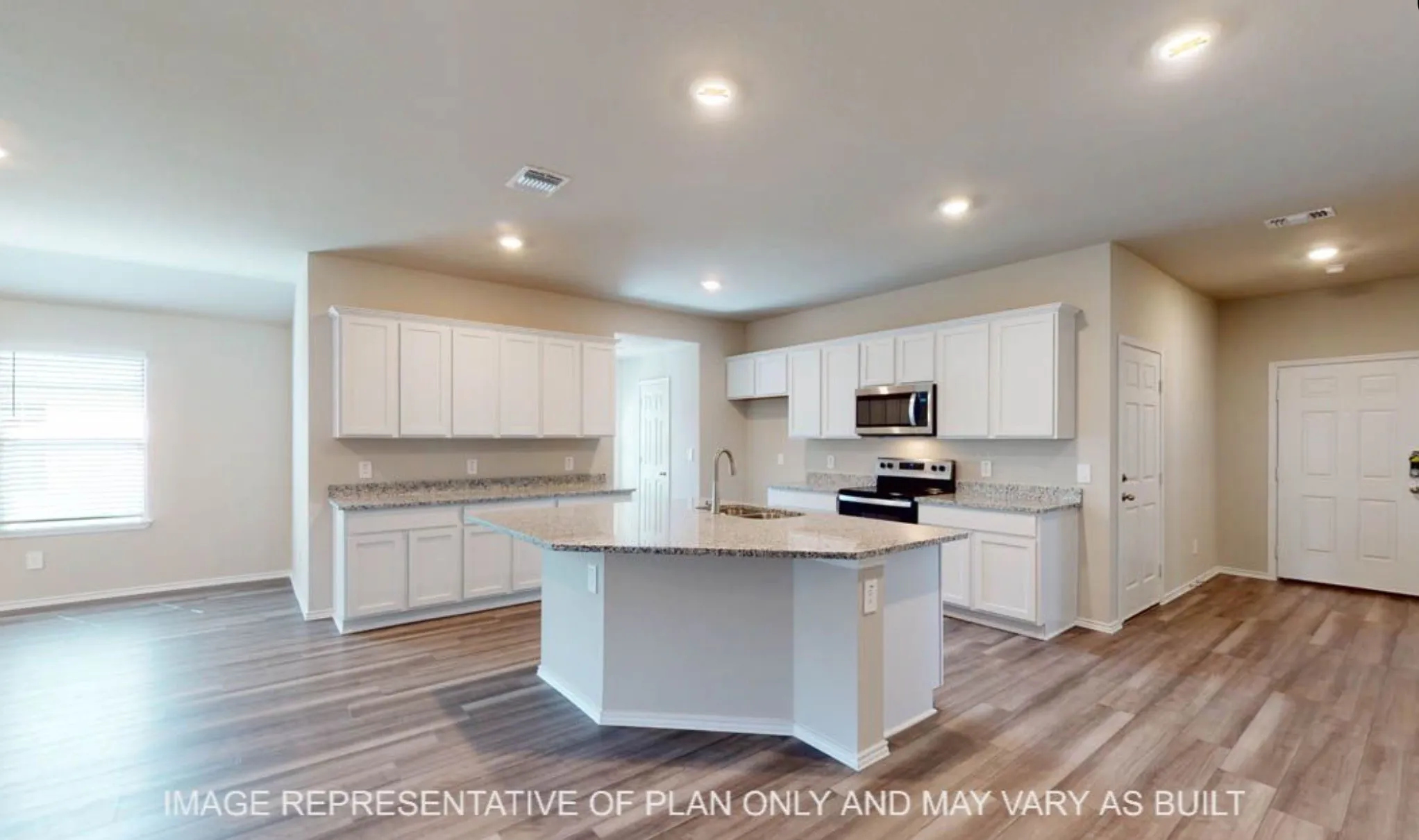 Open-concept kitchen with a central island, stainless steel appliances, granite countertops, white cabinetry, and wood-finish flooring