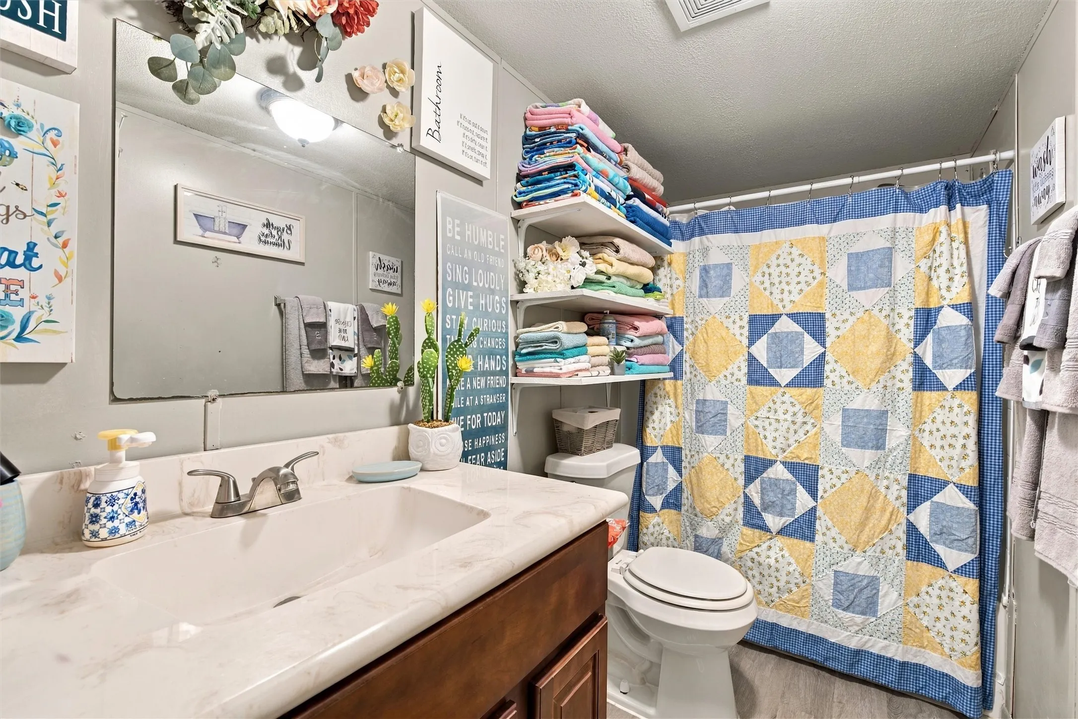 Vanity with an integrated sink and chrome faucet