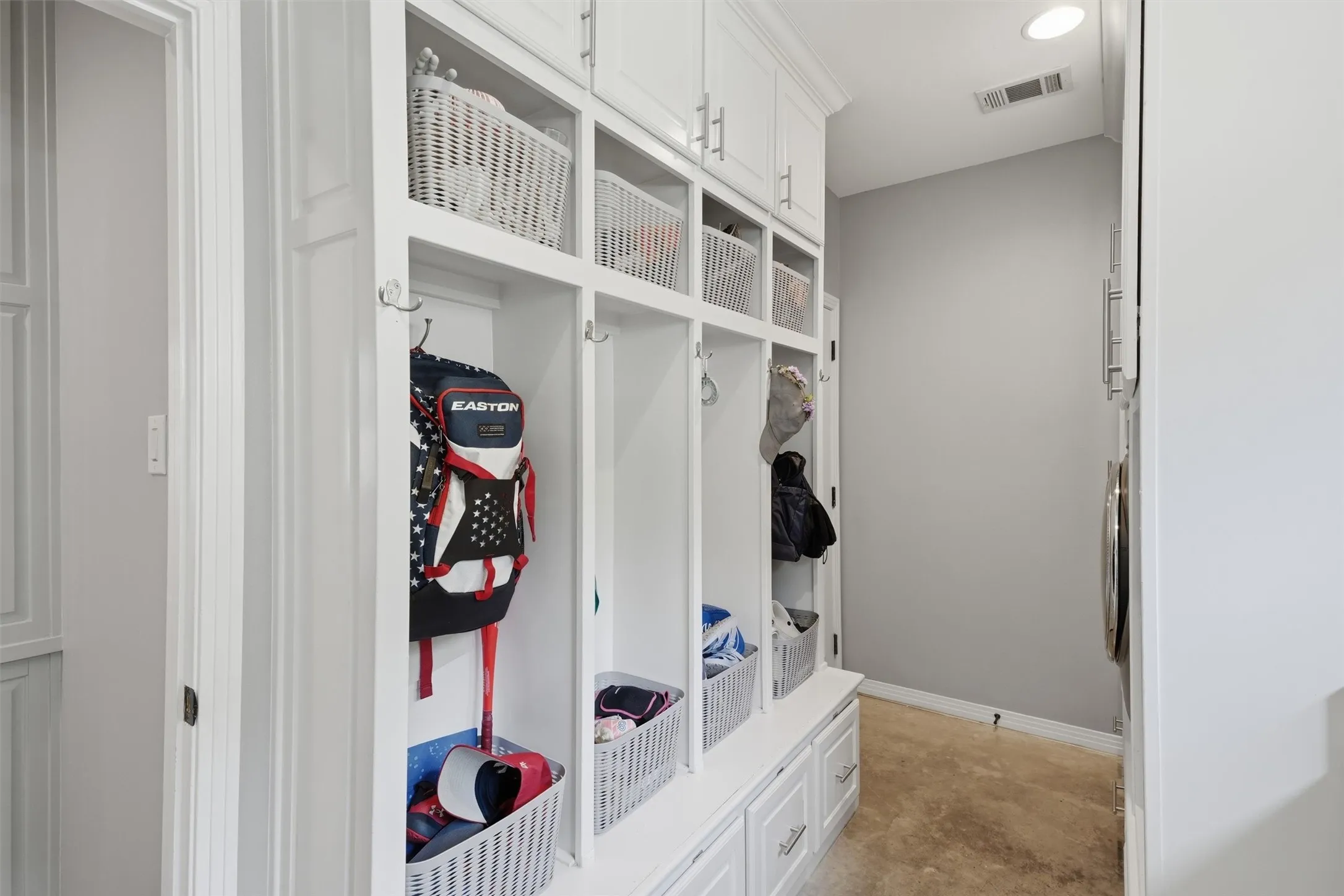 Mud room directly off the garage and in the laundry room - the perfect place to keep everyone's backpacks, sports gear and shoes organized.
