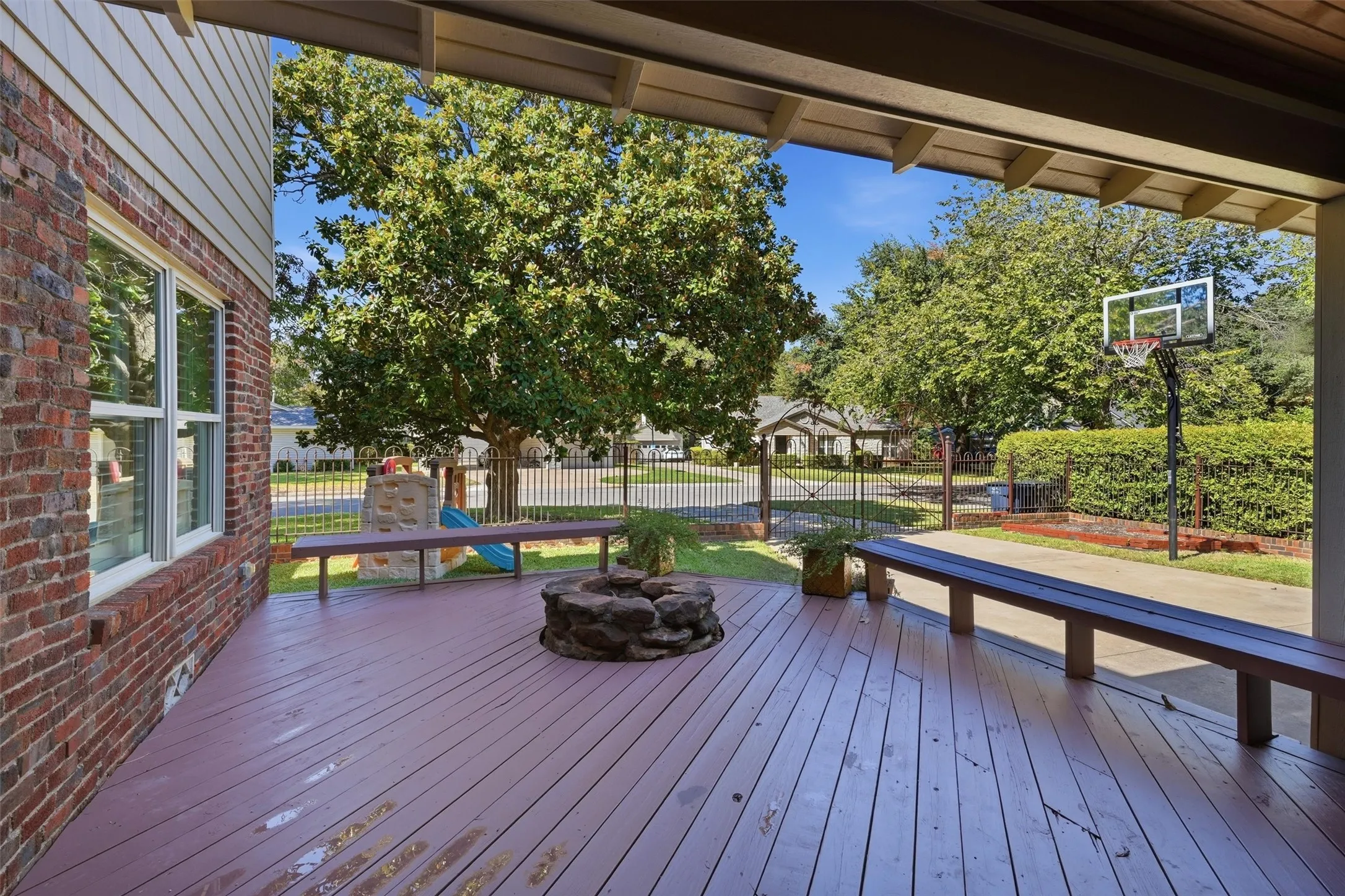Large backyard deck with a fireplace - perfect for hosting year round get togethers!