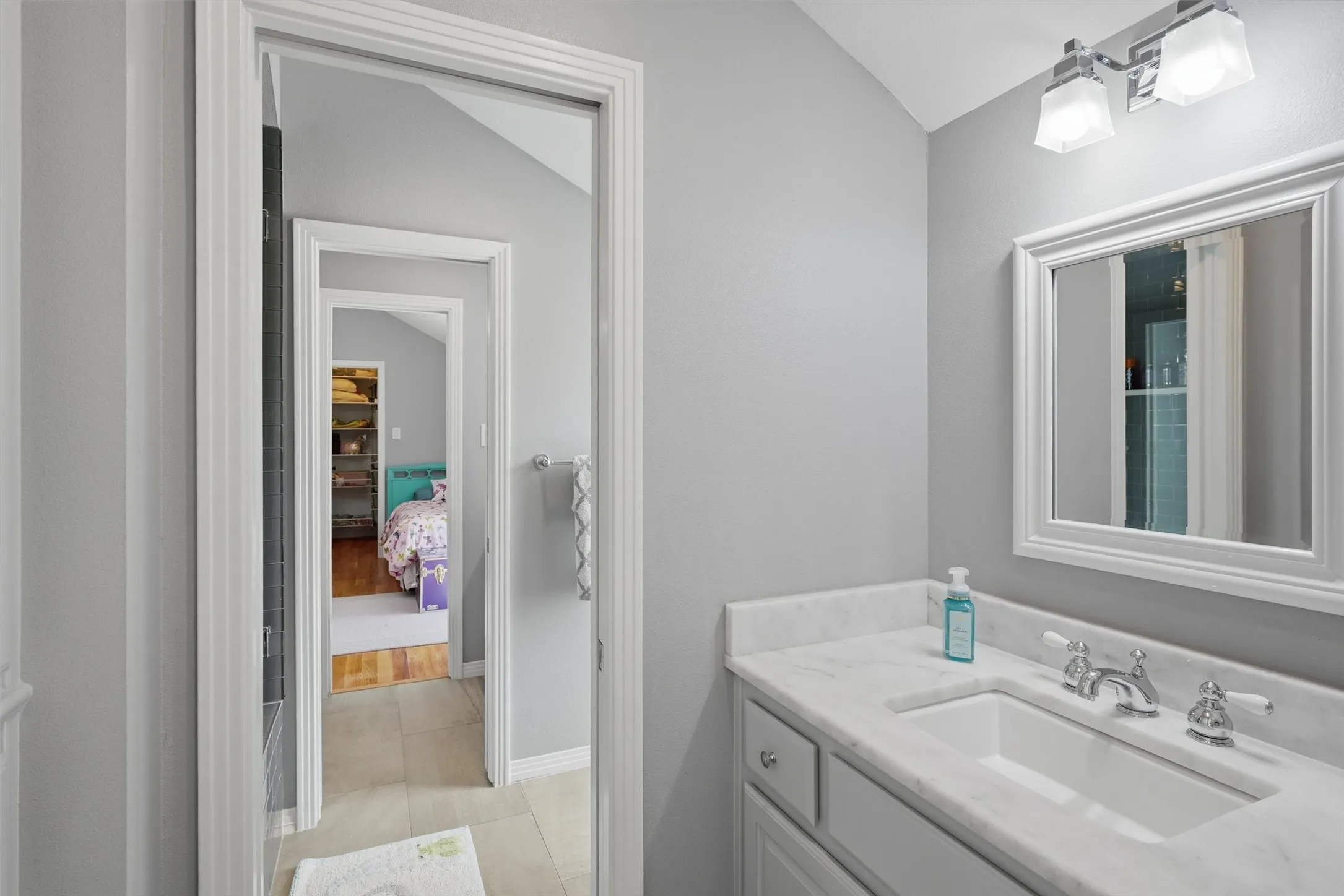 Great view of the upstairs jack and jill bathroom. Each bedroom has it's own sink.