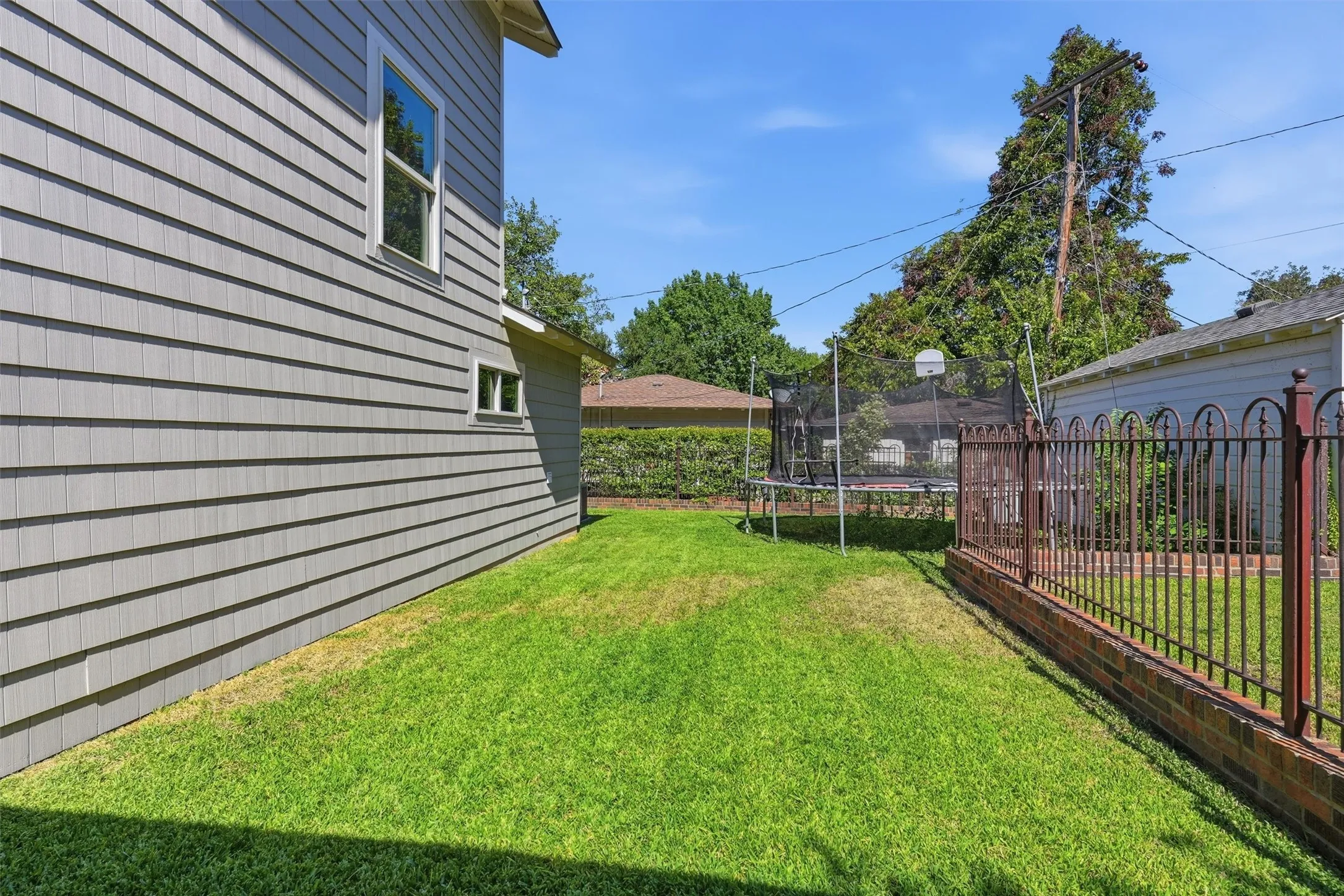 Great backyard space with an extended fenced in play area.