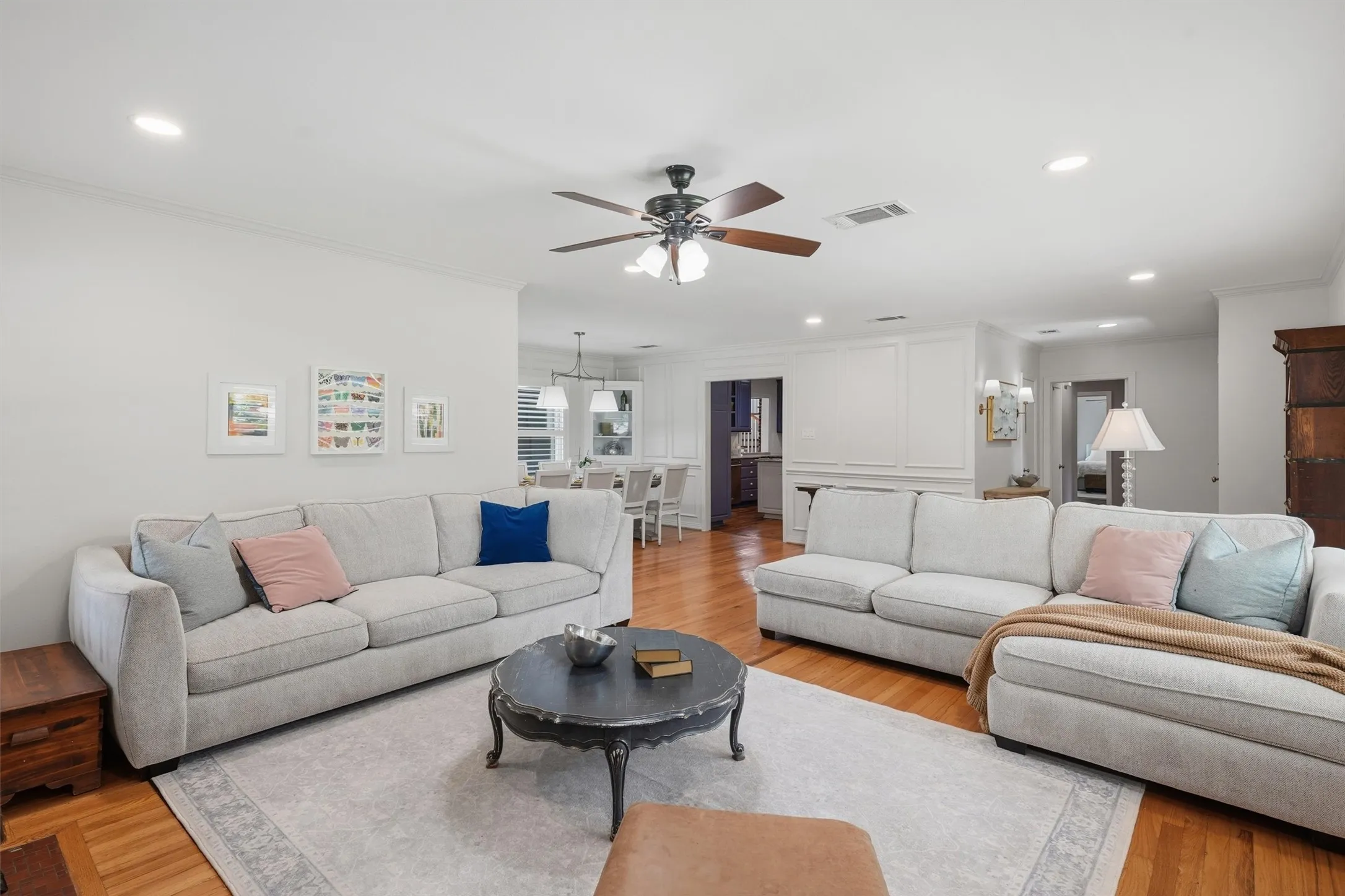 This living room provides seamless flow into the adjacent formal dining room, and kitchen.