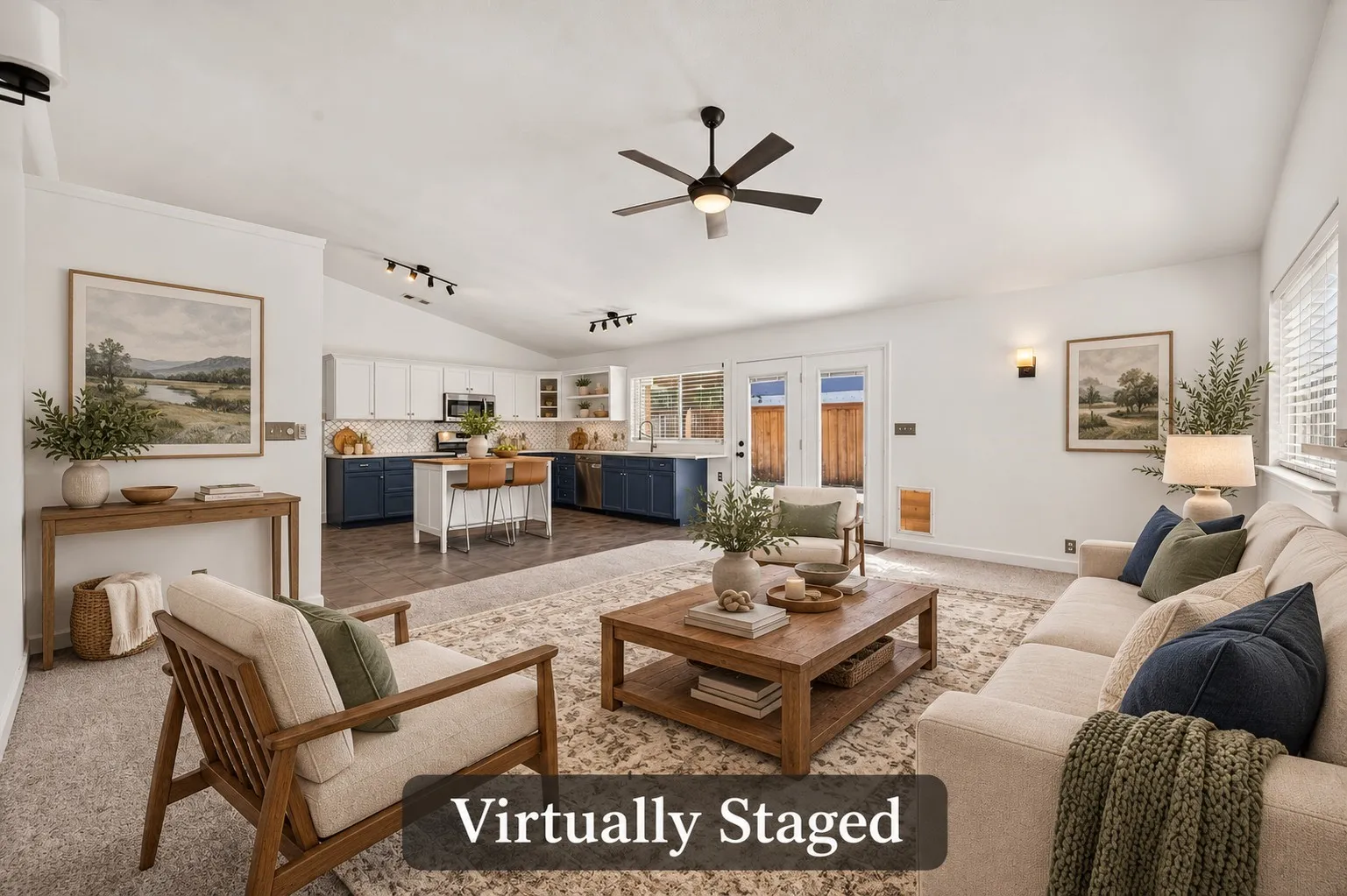 Relax in the spacious den, where natural light, a high ceiling and an open connection to the kitchen create an easygoing gathering space. Virtually staged.