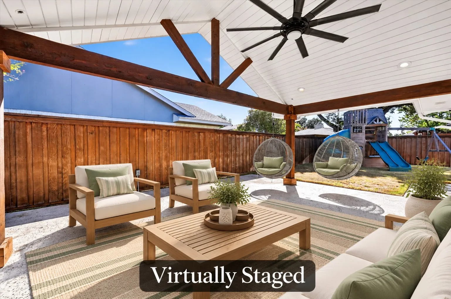 The 6' board on board fenced backyard offers room to enjoy the outdoors, with a generous covered patio, brick planter box and a 6-foot board-on-board cedar fence. Virtually staged.