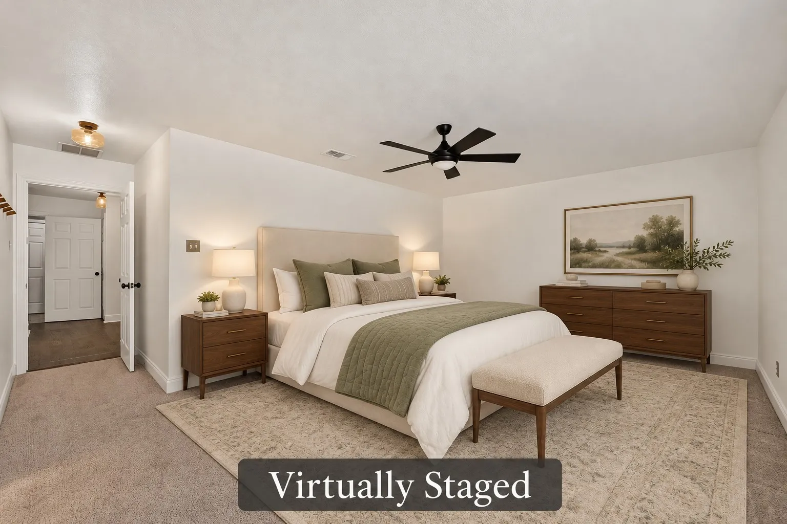 The spacious primary bedroom offers a soothing neutral palette, a ceiling fan and plenty of room to create your own restful retreat. Virtually staged.