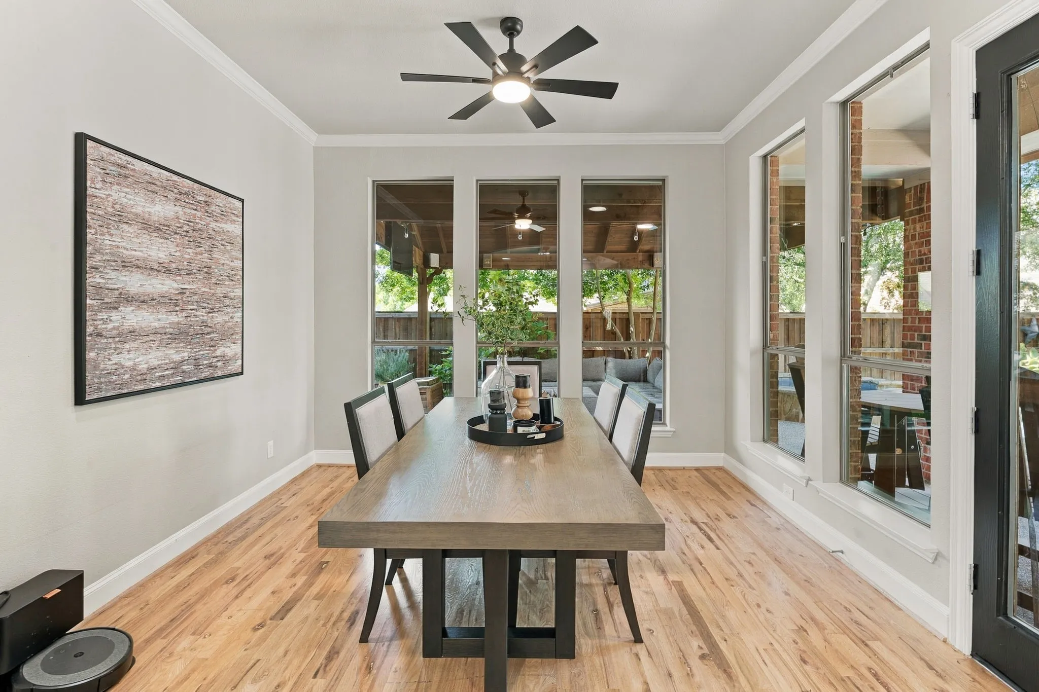 Breakfast Area, Alternate View | Window-lined dining nook overlooks the backyard and connects directly to the kitchen and outdoor living area.