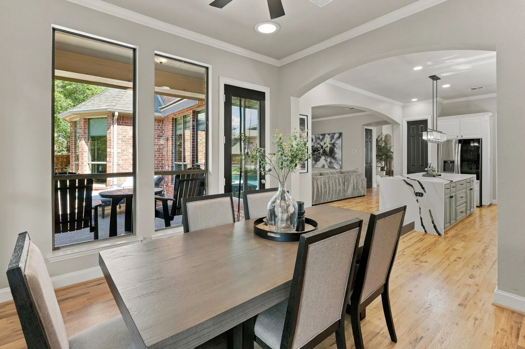 Breakfast Area | Casual dining space beside the kitchen, with wood flooring, large windows and access to the covered patio.