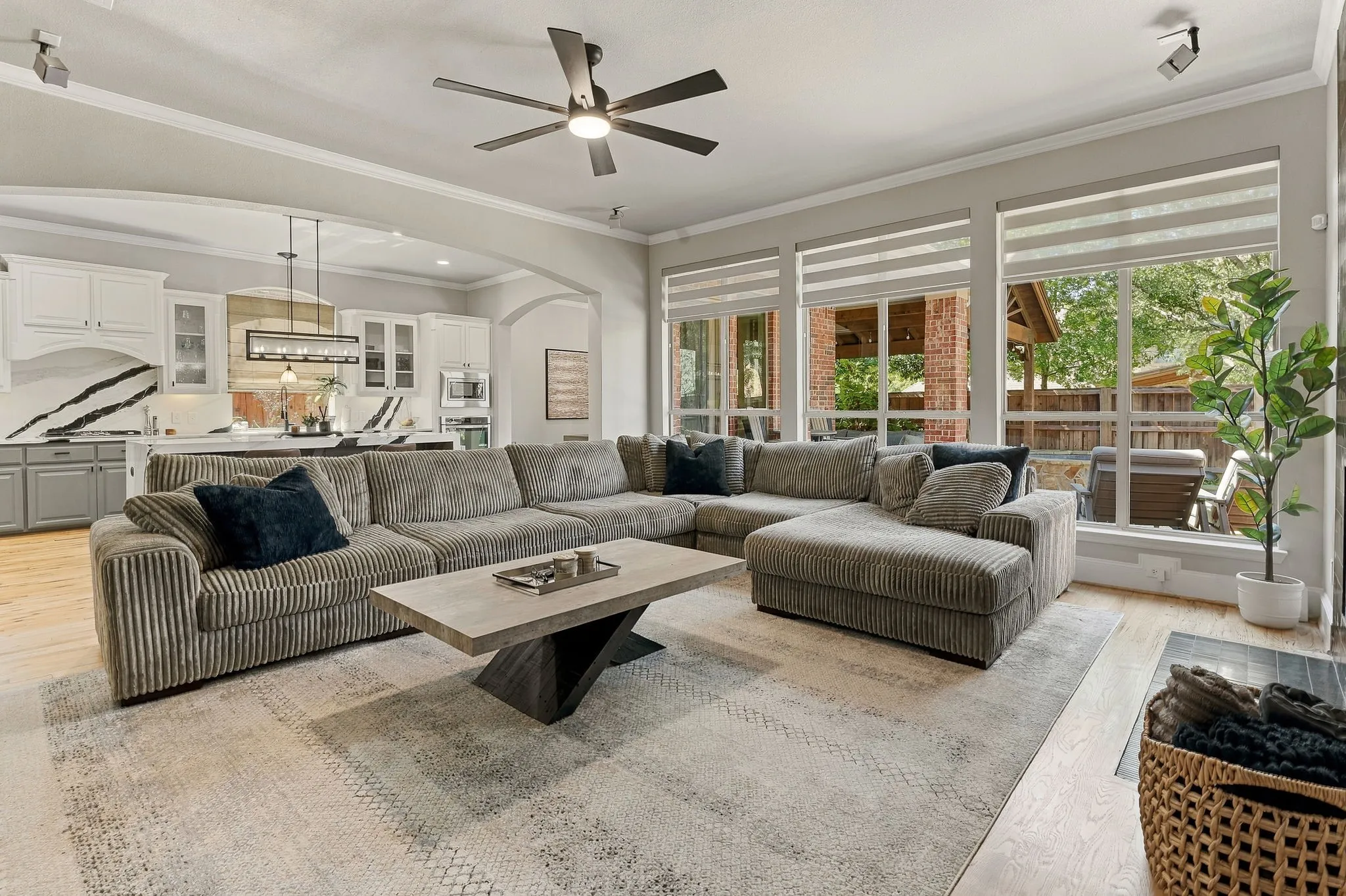 Family Room and Kitchen Connection | Open layout connects the main living area to the remodeled kitchen and breakfast area, with backyard-facing windows providing natural light.