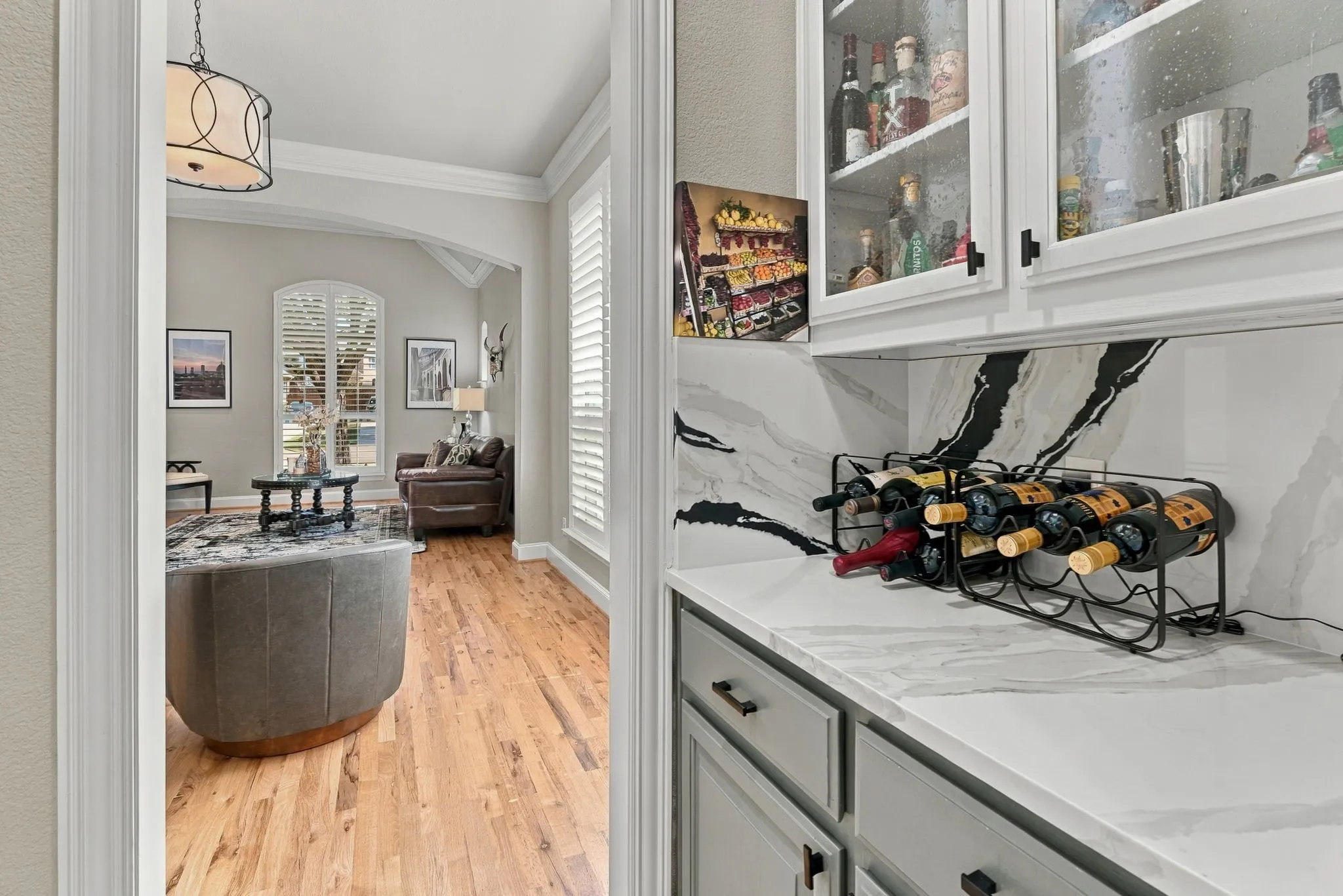 Butler's Pantry / Serving Area | Built-in upper and lower cabinetry with countertop serving space creates a convenient transition near the kitchen and formal dining room.