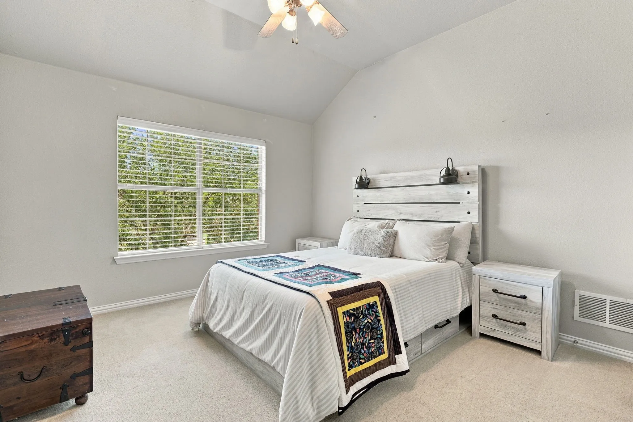 Upstairs Secondary Bedroom | Bright bedroom with carpet, a ceiling fan and a large window, providing flexible sleeping or guest space.