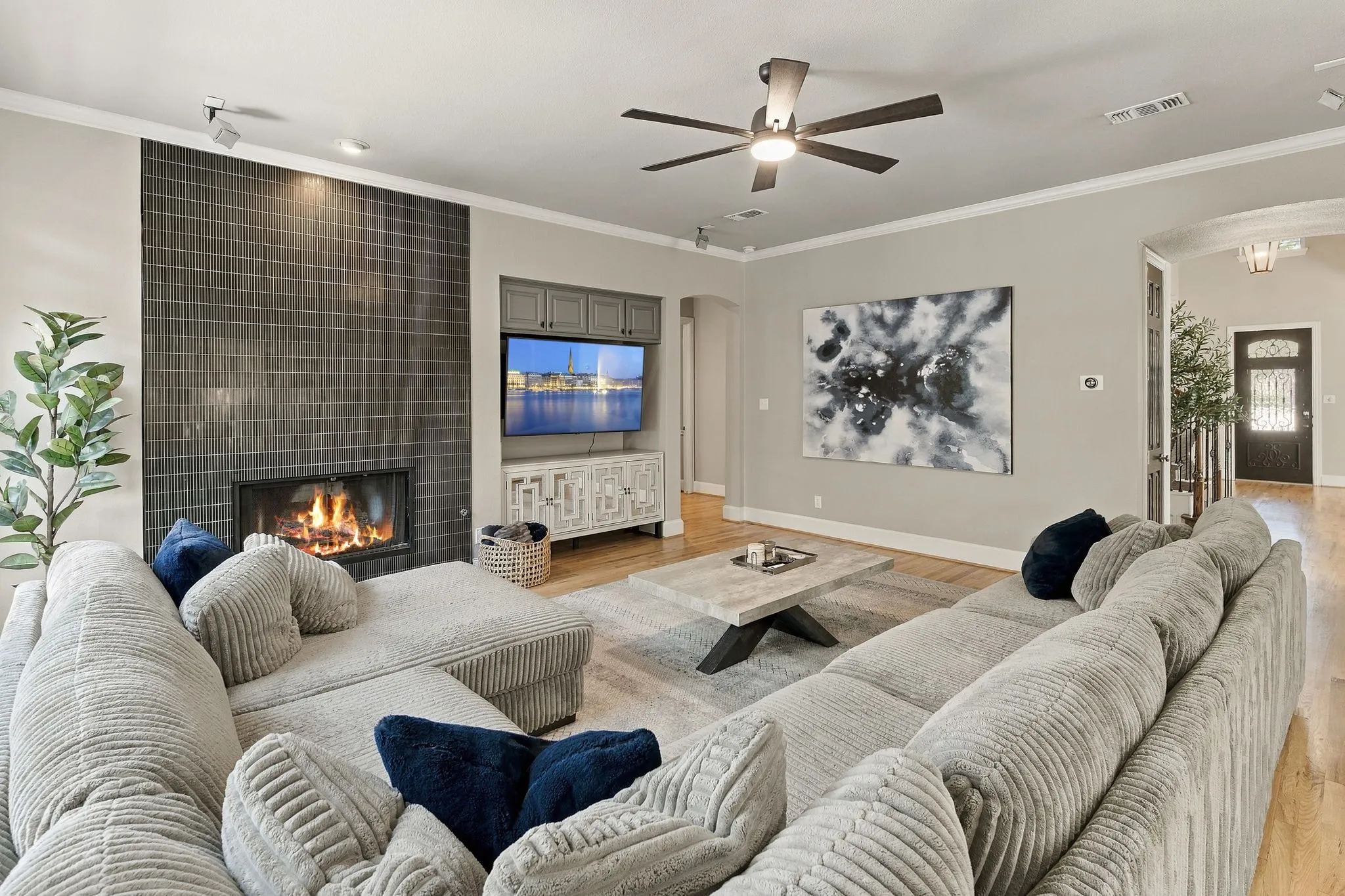 Family Room, Alternate View | Spacious main-level gathering room with a ceiling fan, recessed lighting, fireplace and open circulation to adjoining living spaces.