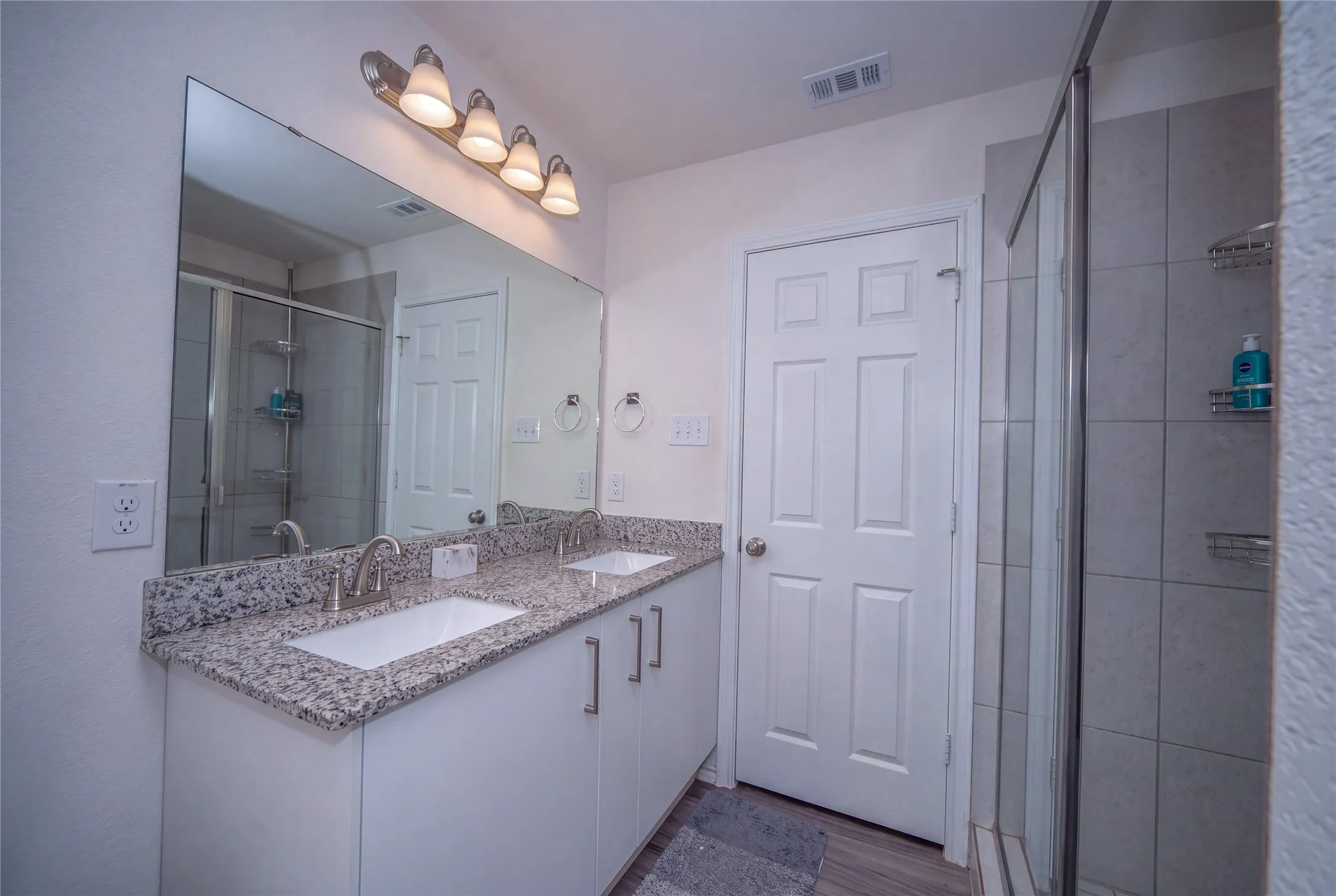 Dual vanity with granite countertop and integrated sinks